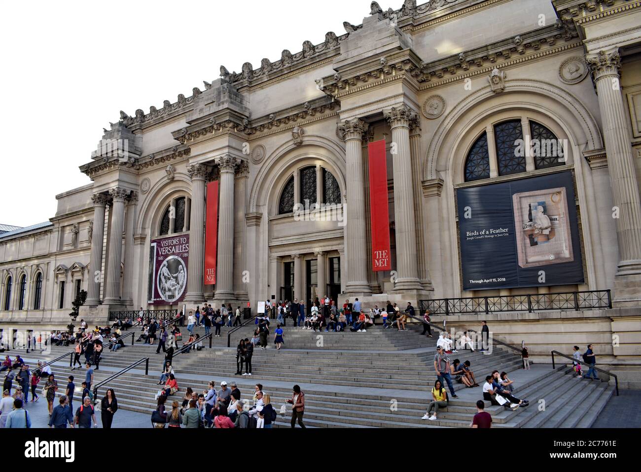 Visitors gather on the steps outside the Metropolitan Museum Of Art along Museum Mile on Manhattan's upper east side, New York City. Stock Photo