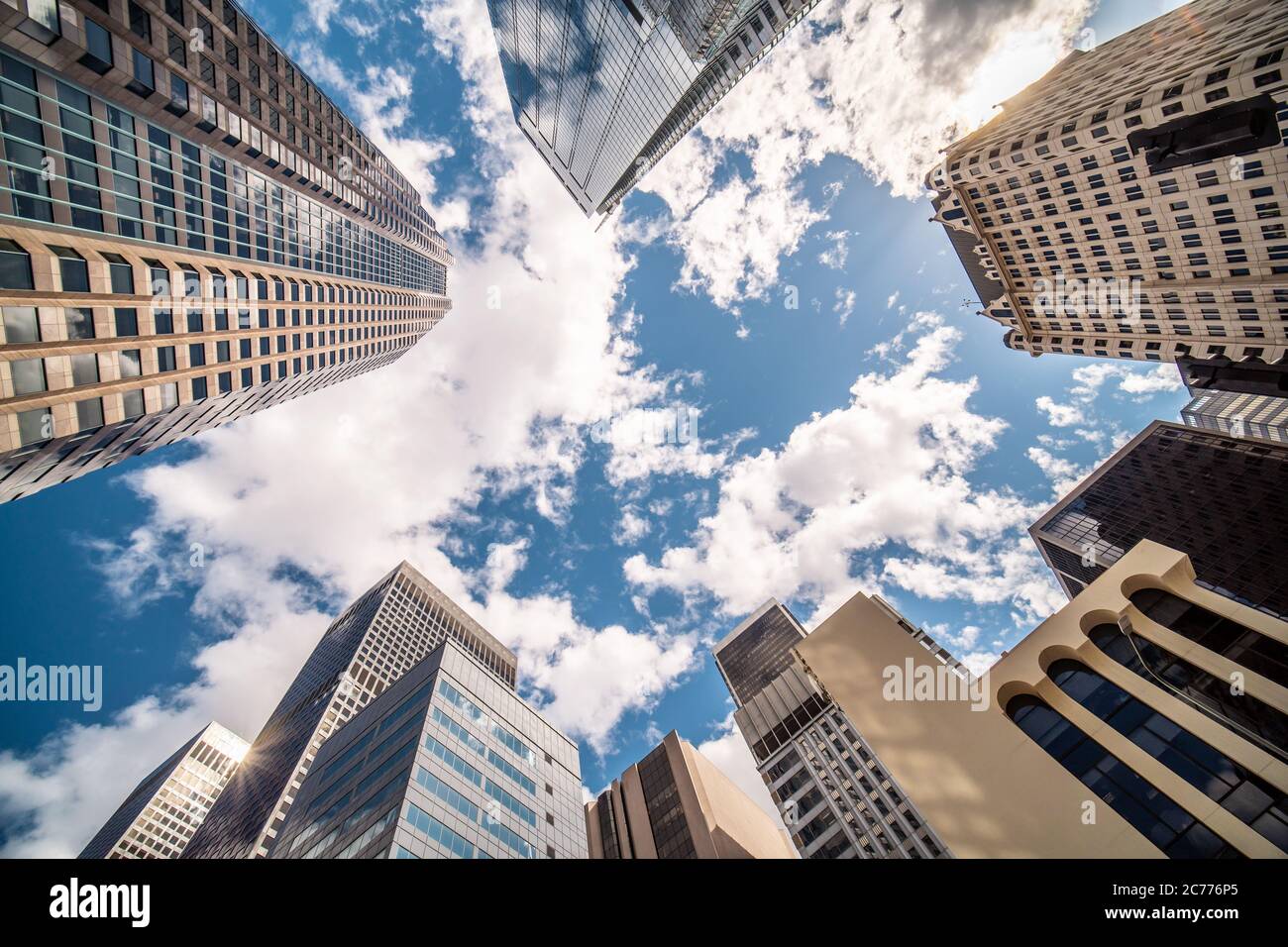 Business and finance concept, looking up at modern office building architecture in the financial district DTLA against the blue sky. Los Angeles Stock Photo