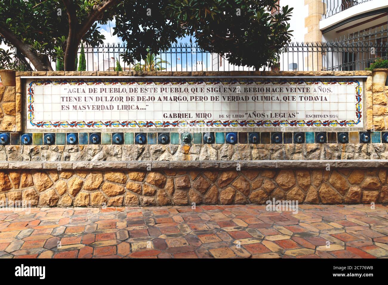 Polop de Marina, Costa Blanca, Spain - 3 Otober 2019: Water fountains in public park with with a Spanish quote of Gabriel Miro on tiles, which means ' Stock Photo