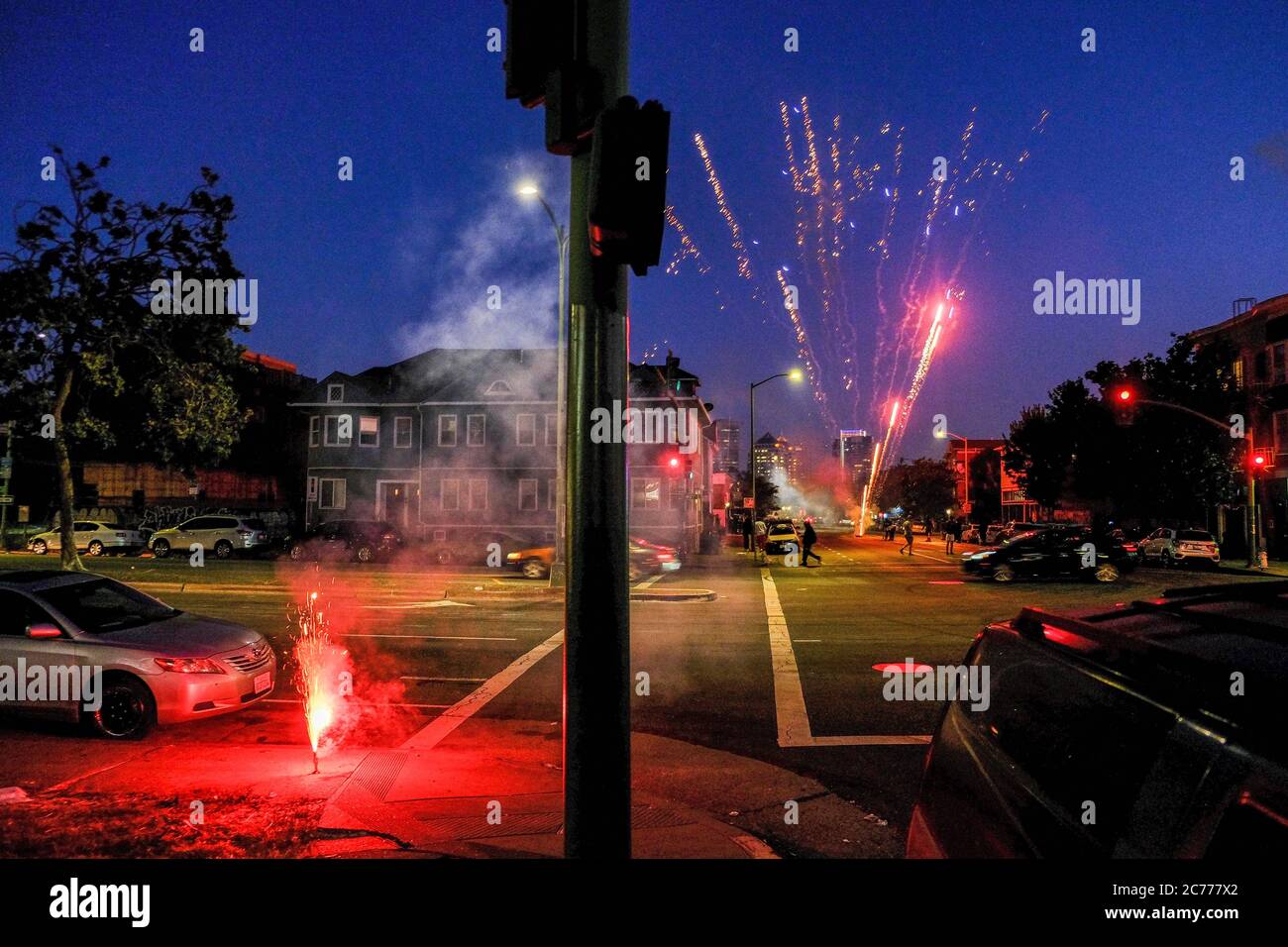 Illegal fireworks seen in Oakland, California on the night of the Fourth of July. Municipally sanctioned fireworks shows were closed due to concerns of Covid-19 Stock Photo
