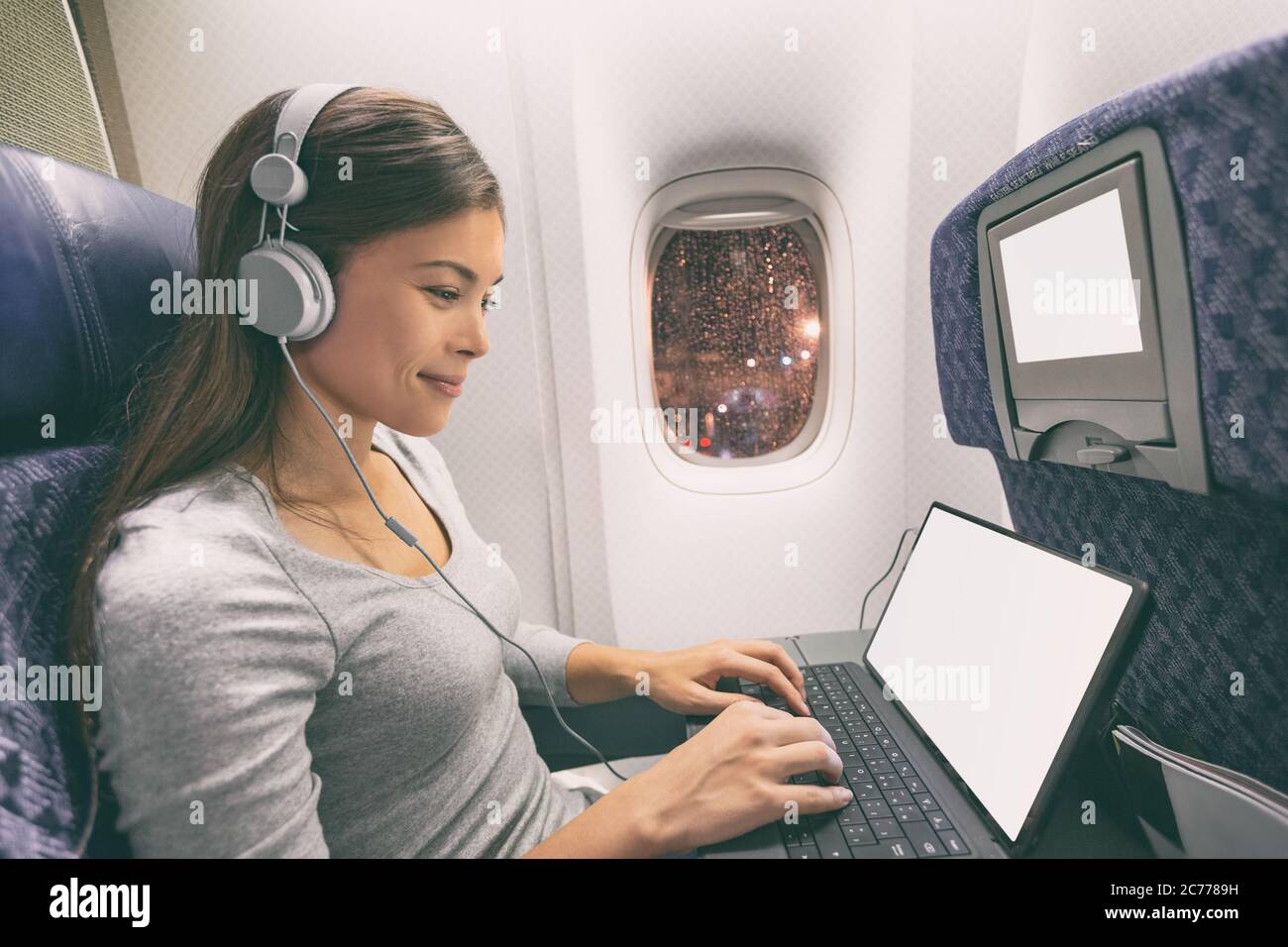 Plane passenger business woman professional working in airplane cabin