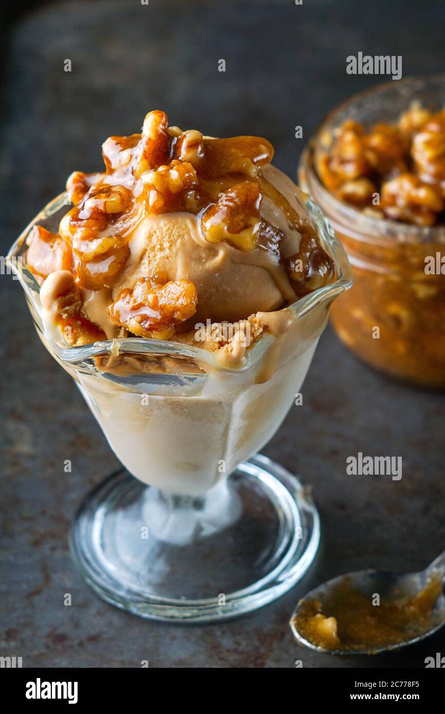 Salted caramel ice cream with wet walnuts Stock Photo Alamy