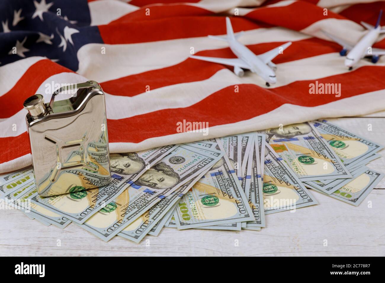 Petroleum products price on US dollar oil business, rising world oil prices brand USA flag model airplane Stock Photo