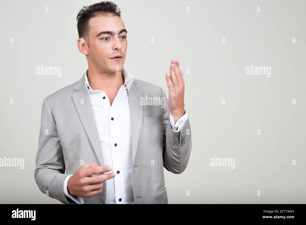 Portrait of young handsome businessman wearing suit Stock Photo - Alamy