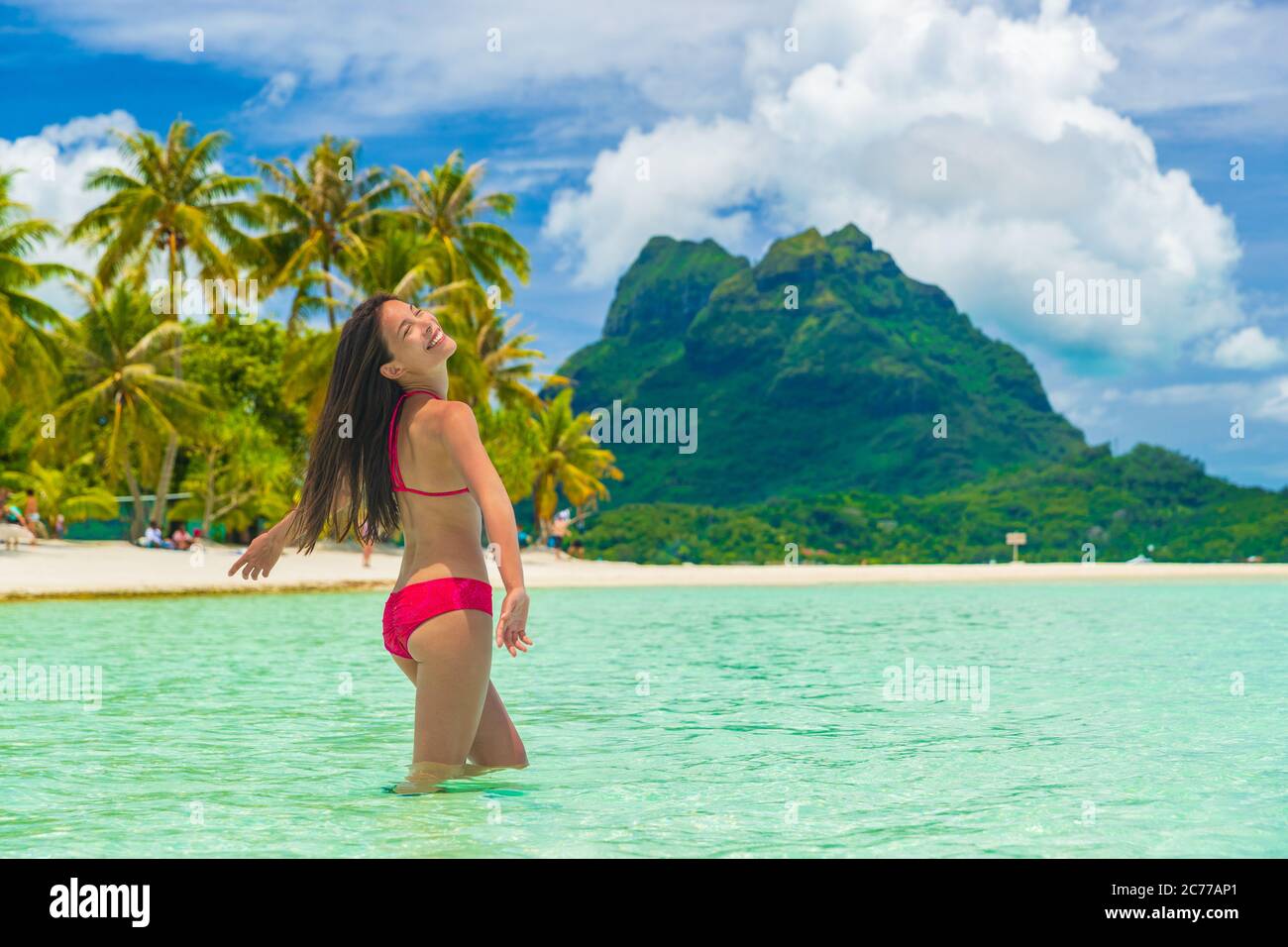 Bora bora luxury vacation travel paradise bikini woman swimming at island  in Tahiti, French Polynesia. Popular honeymoon destination holiday in South  Stock Photo - Alamy