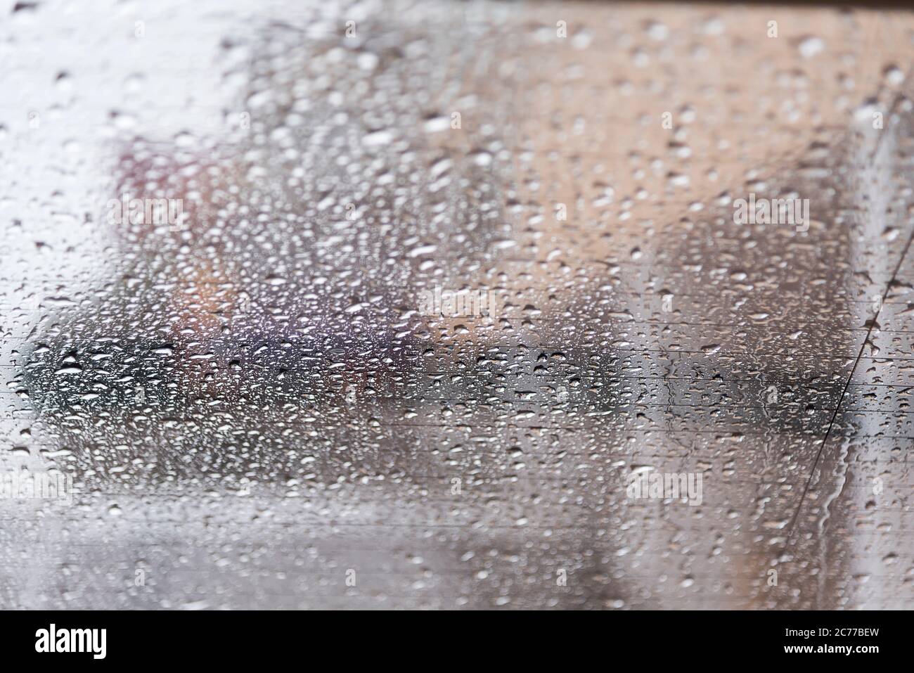 rain drops on back side glass shield car Stock Photo