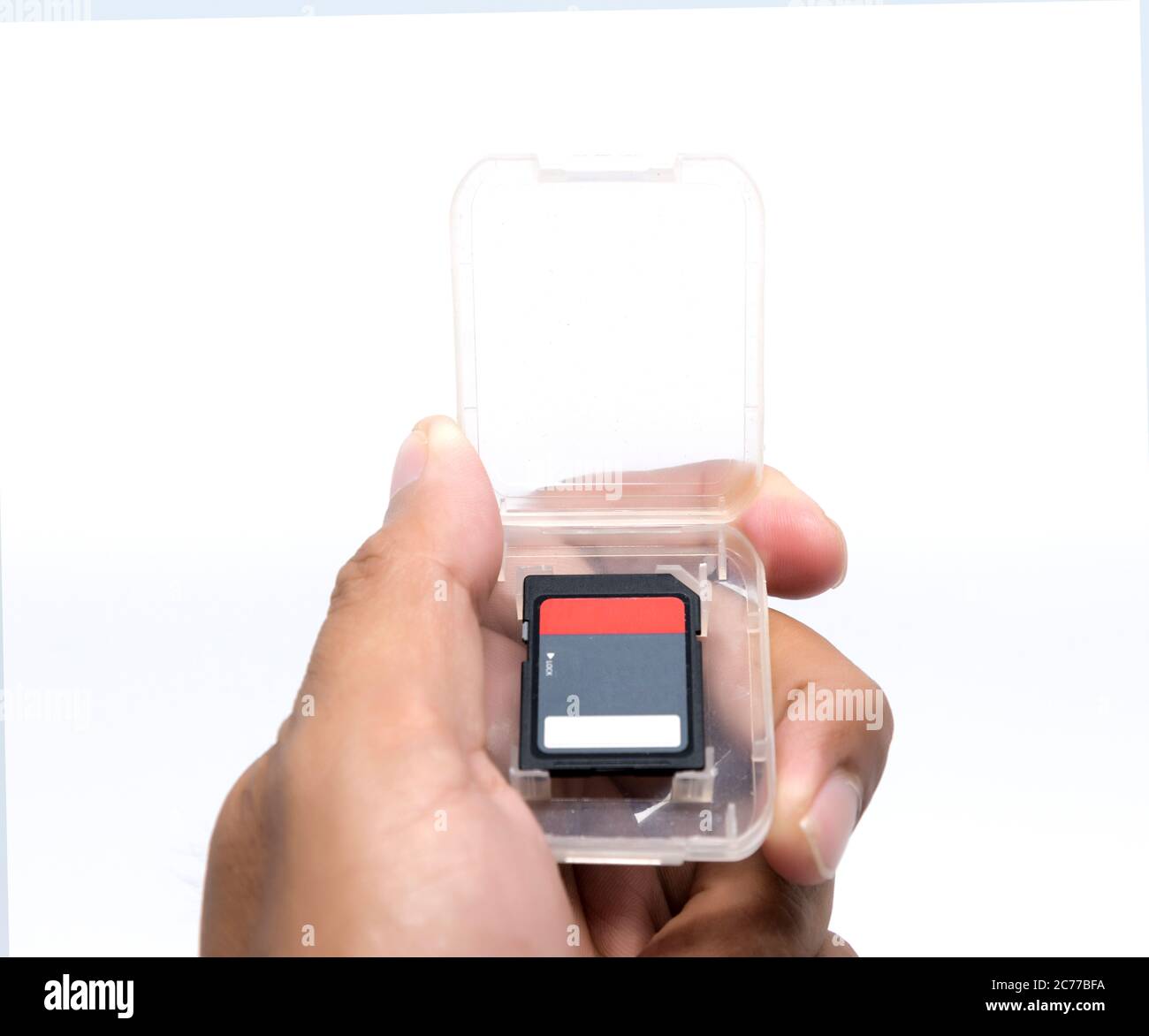 hand holding compact flash memory card Stock Photo