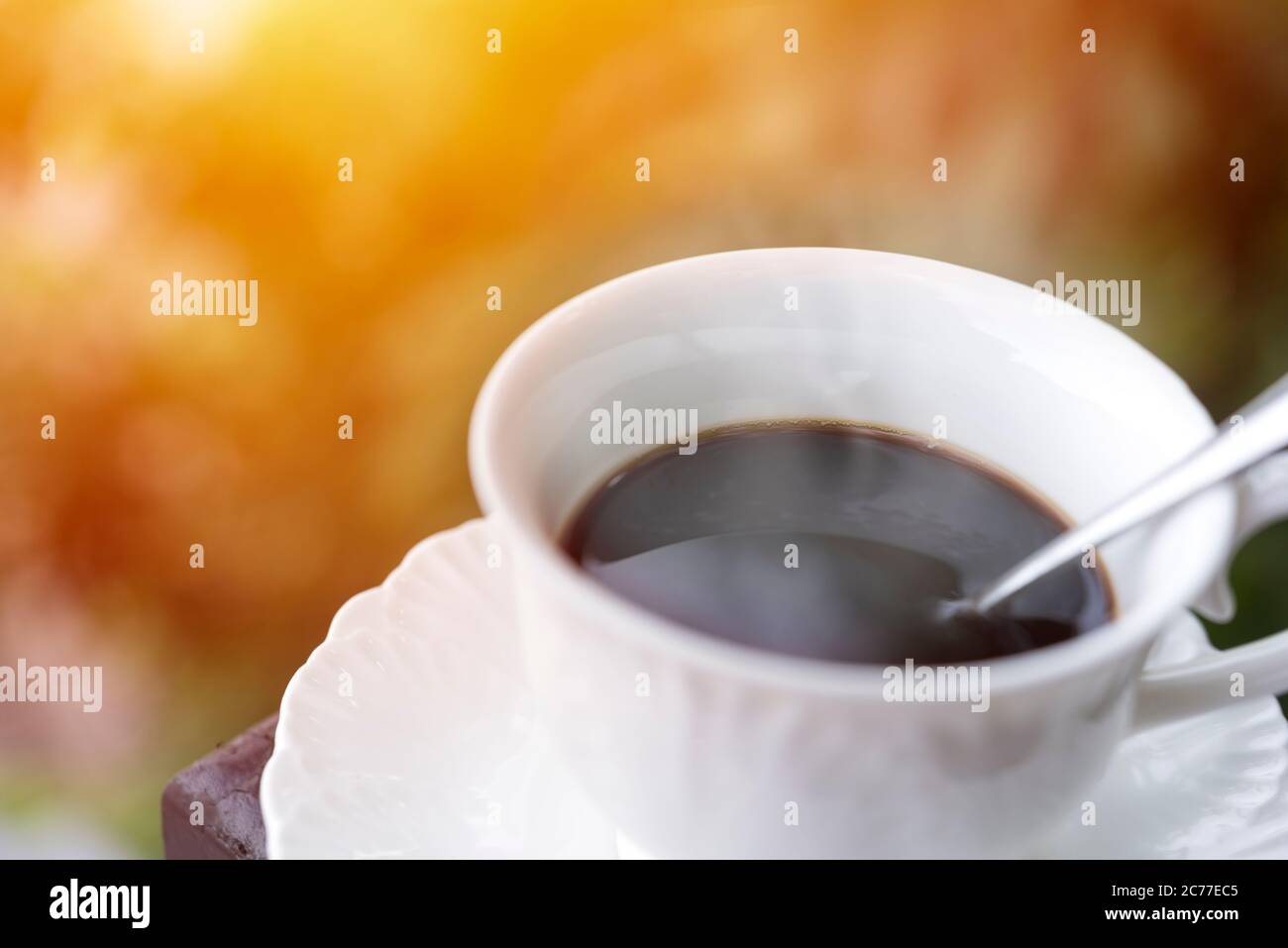 Morning coffee at balcony with sun rise and sun ray soft focus ...