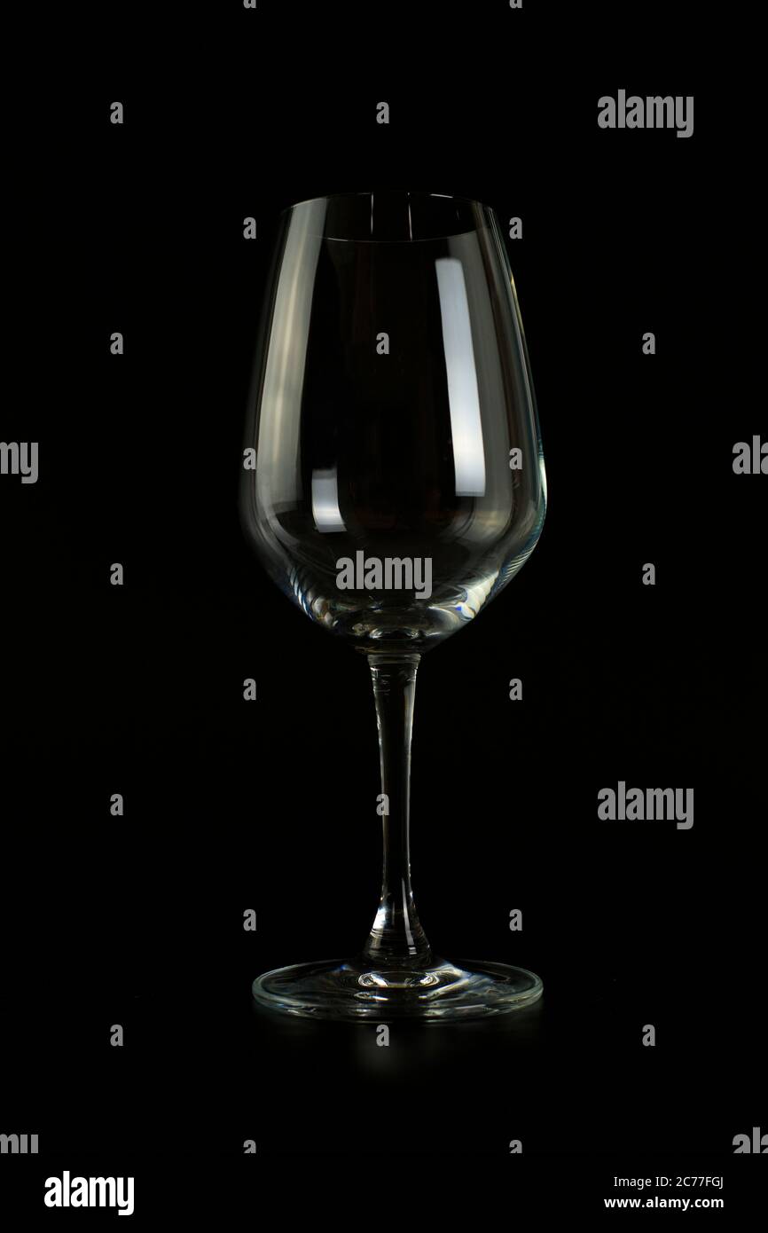 Empty wine glass on black background. Stock Photo