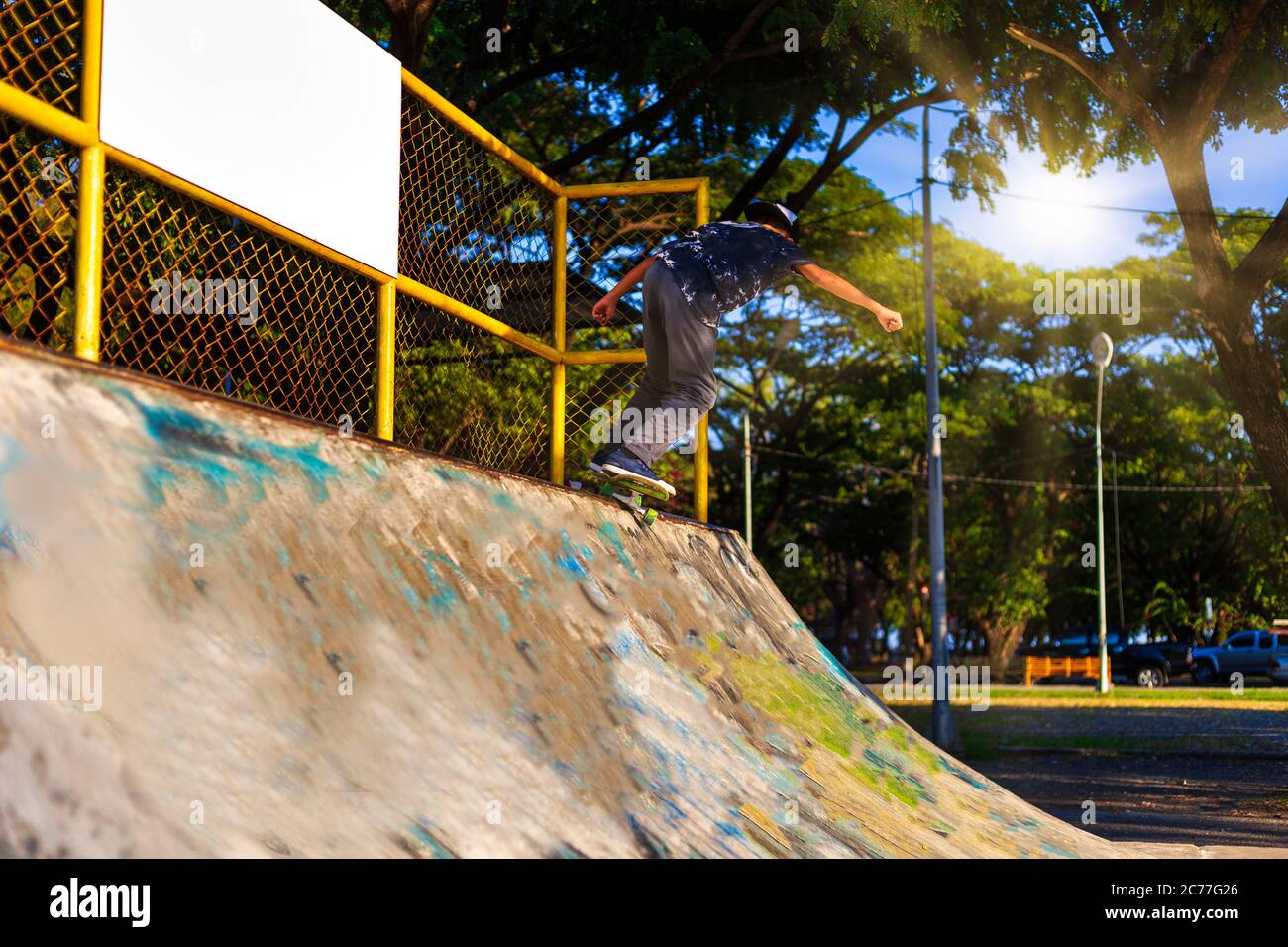 Young boy jump on ramp with skateboard outdoor Stock Photo Alamy