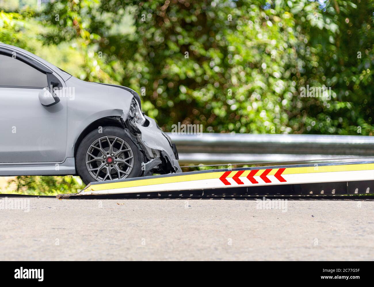 accident Car Slide on truck for move. car have damage by accident on
