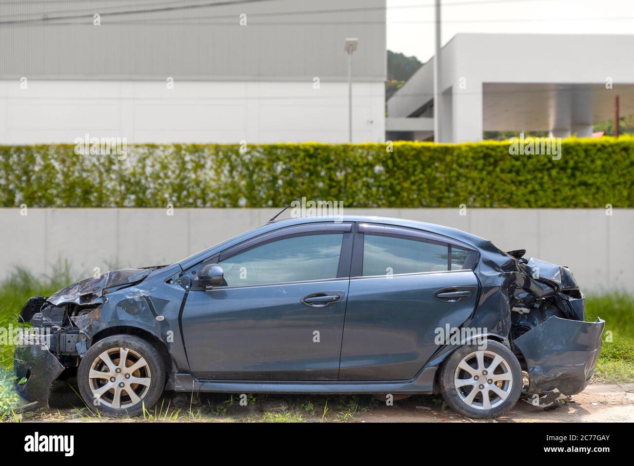Gray color car damaged and broken by accident on road parking can not dirve any more Stock Photo