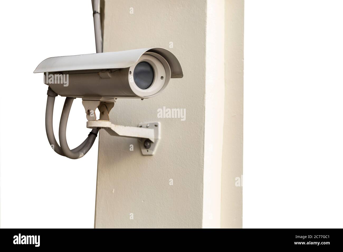 CCTV camera on wall isolated on white background. Stock Photo