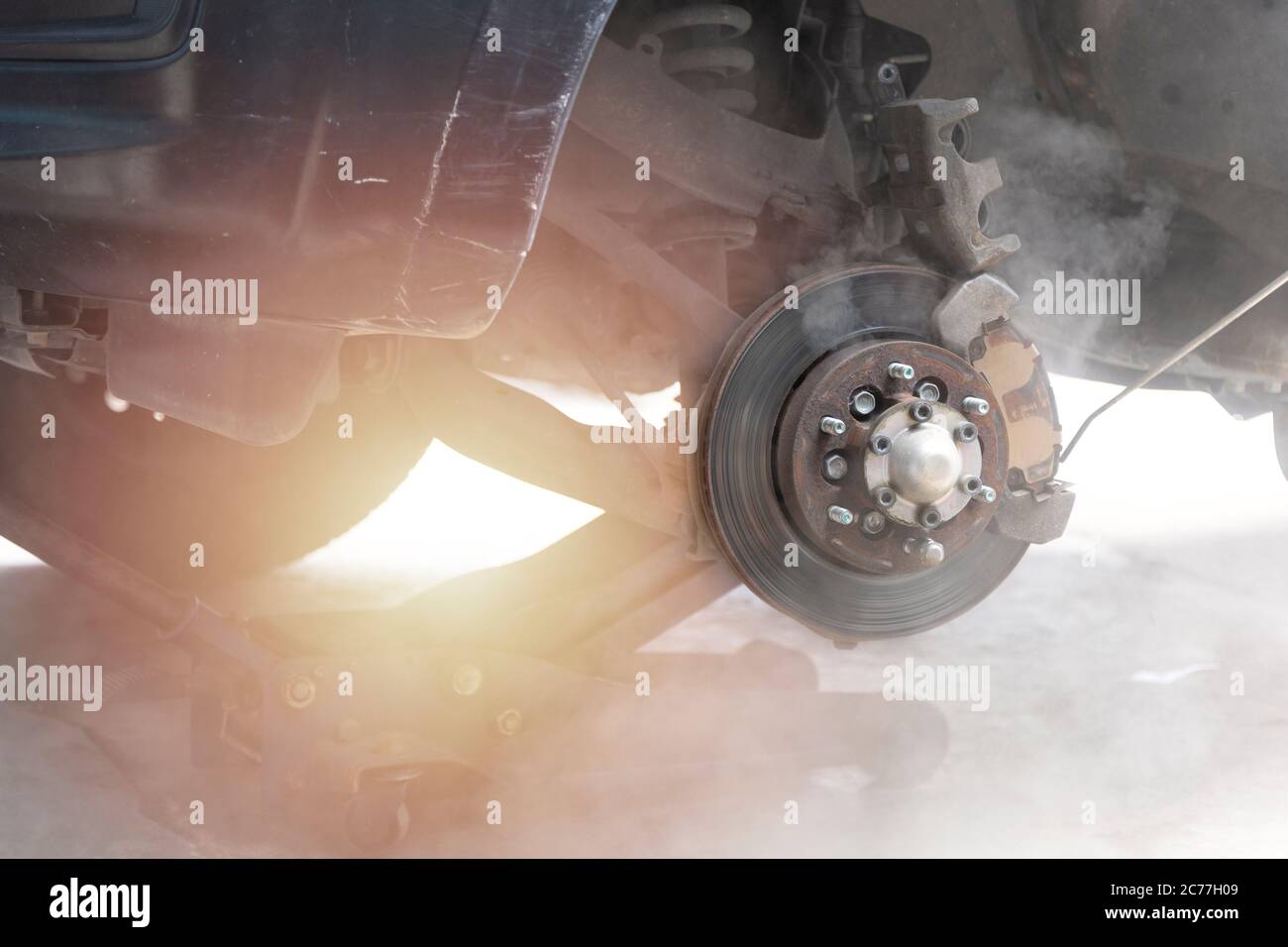 Mechanic use air gun clean disc break take dust removes before change