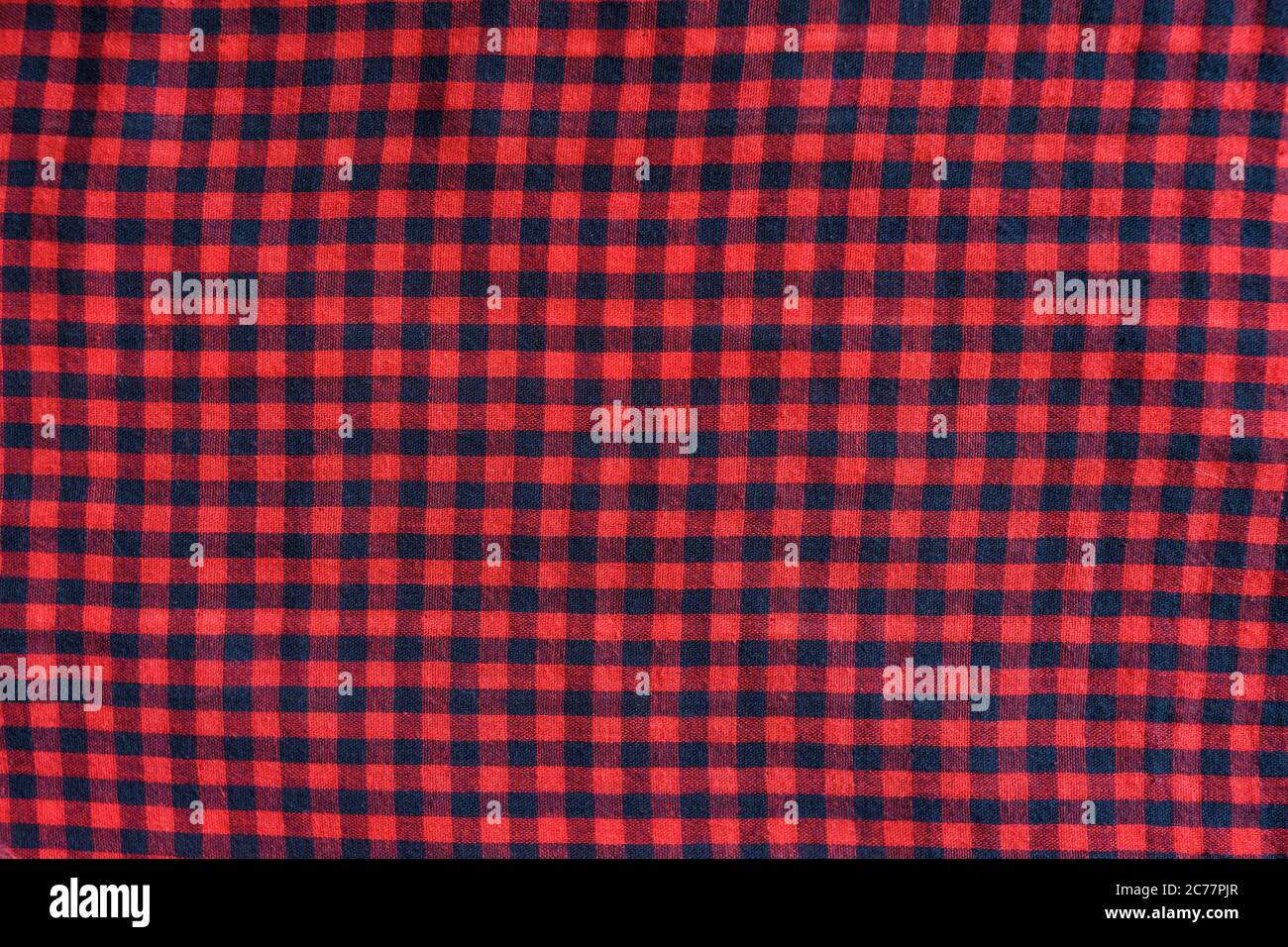Blue with red checkered seamless fabric. Textural background Stock Photo