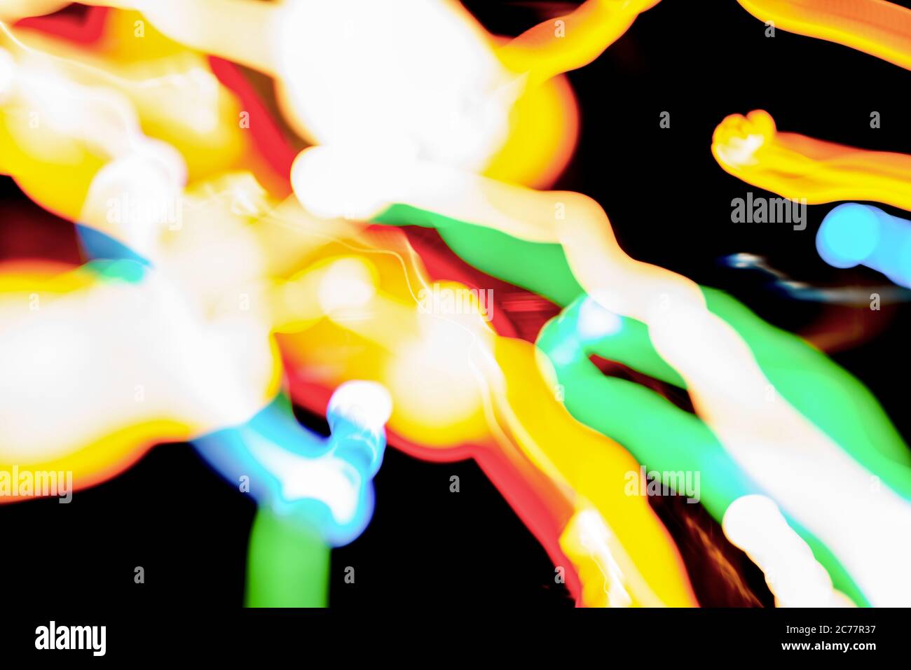 Christmas lights in blurry focus and motion long-exposure photo. Abstract background. Swirl effect. New year, power energy, LED, sci-fi, neon, magic, Stock Photo
