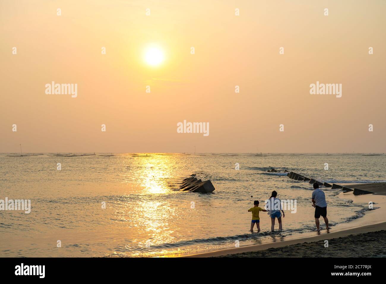 Asian family at the beach hi-res stock photography and images - Alamy