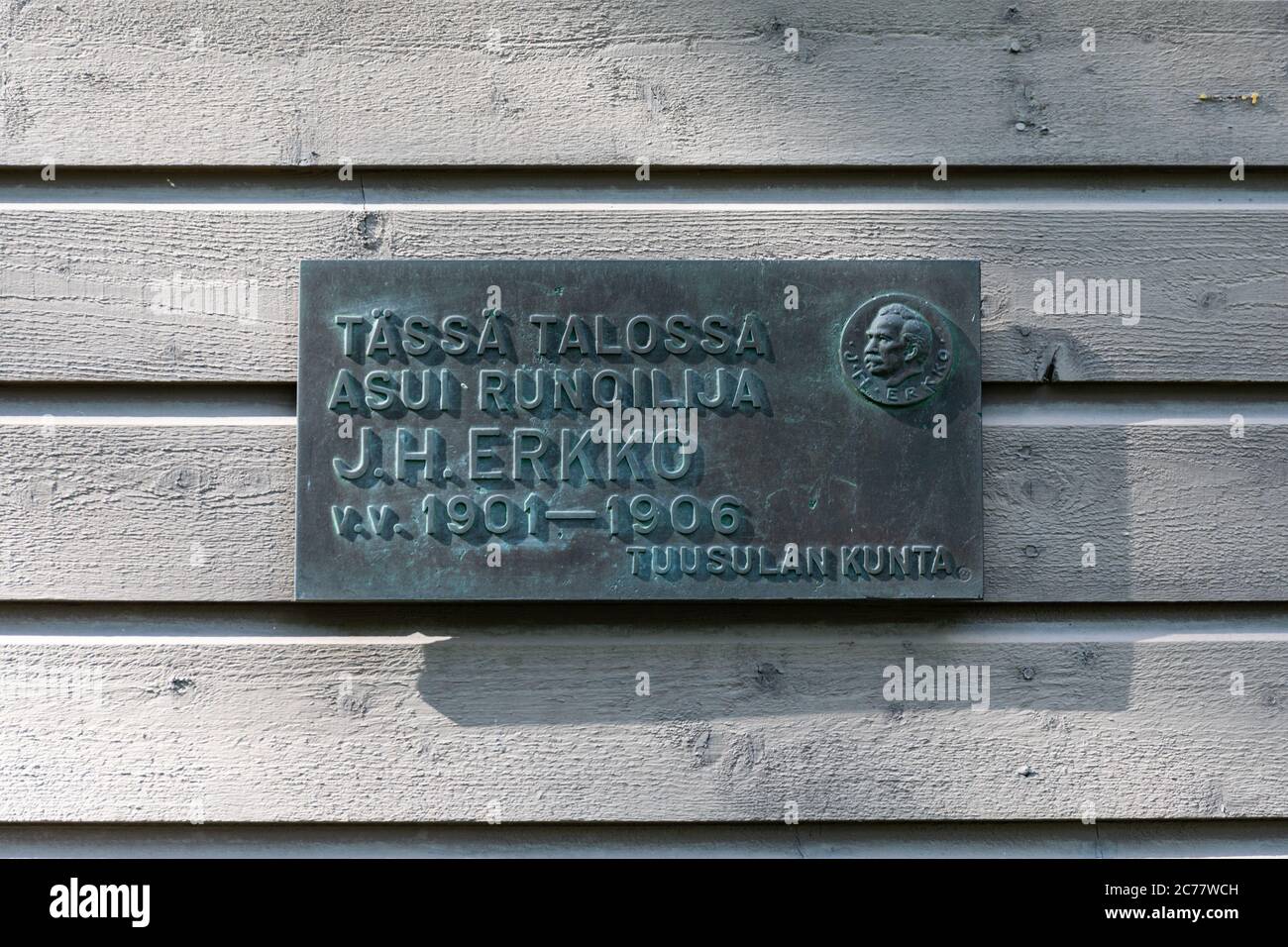 Poet J.H. Erkko lived in this house 1901-1906. Metal placard on Erkkola wall in Tuusula, Finland. Stock Photo