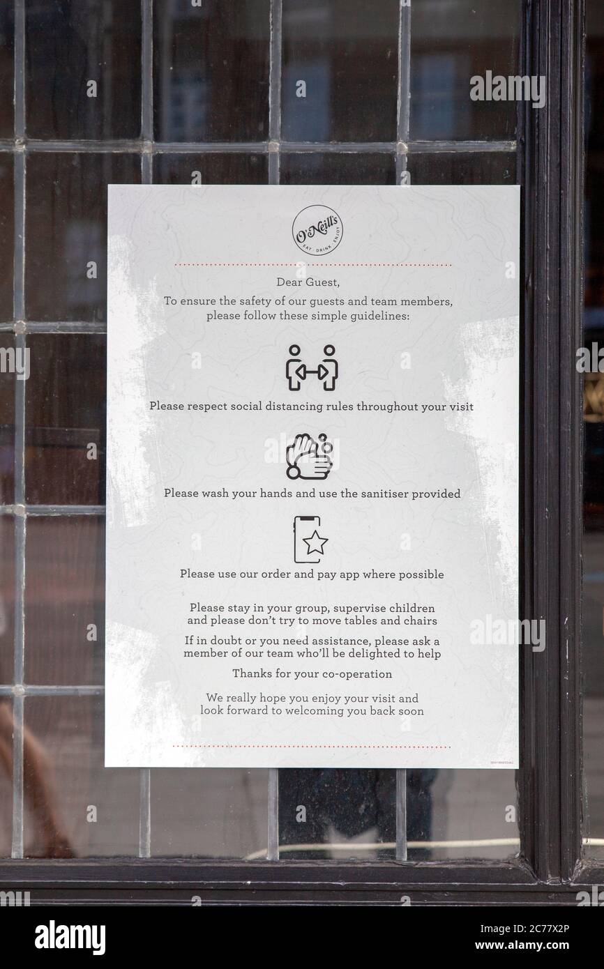 O Neill's Pub Covid Safety Guidelines Sign in Window - London UK Stock Photo