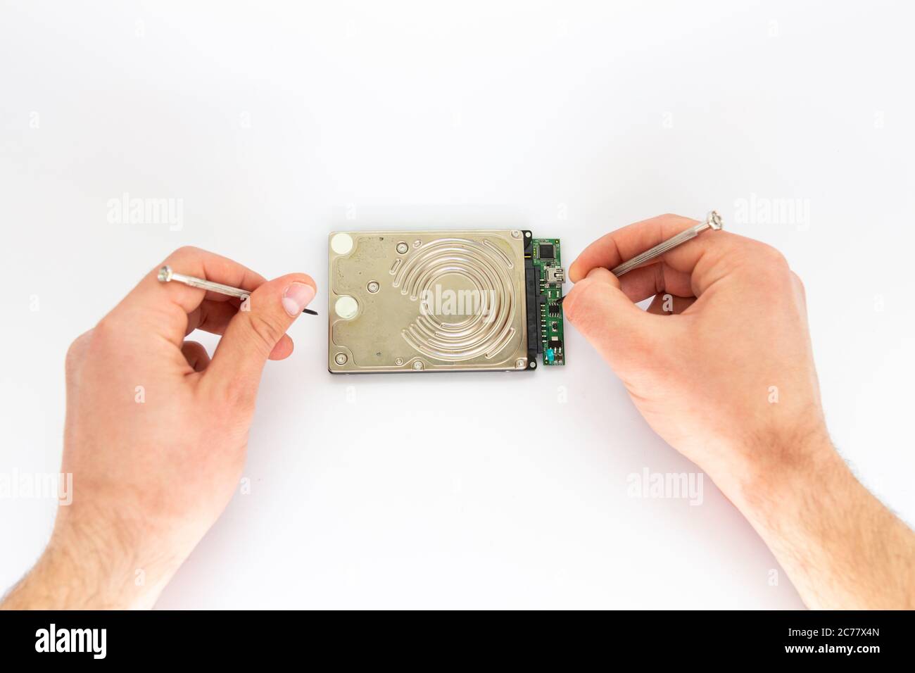 a man repairs hard drive Stock Photo