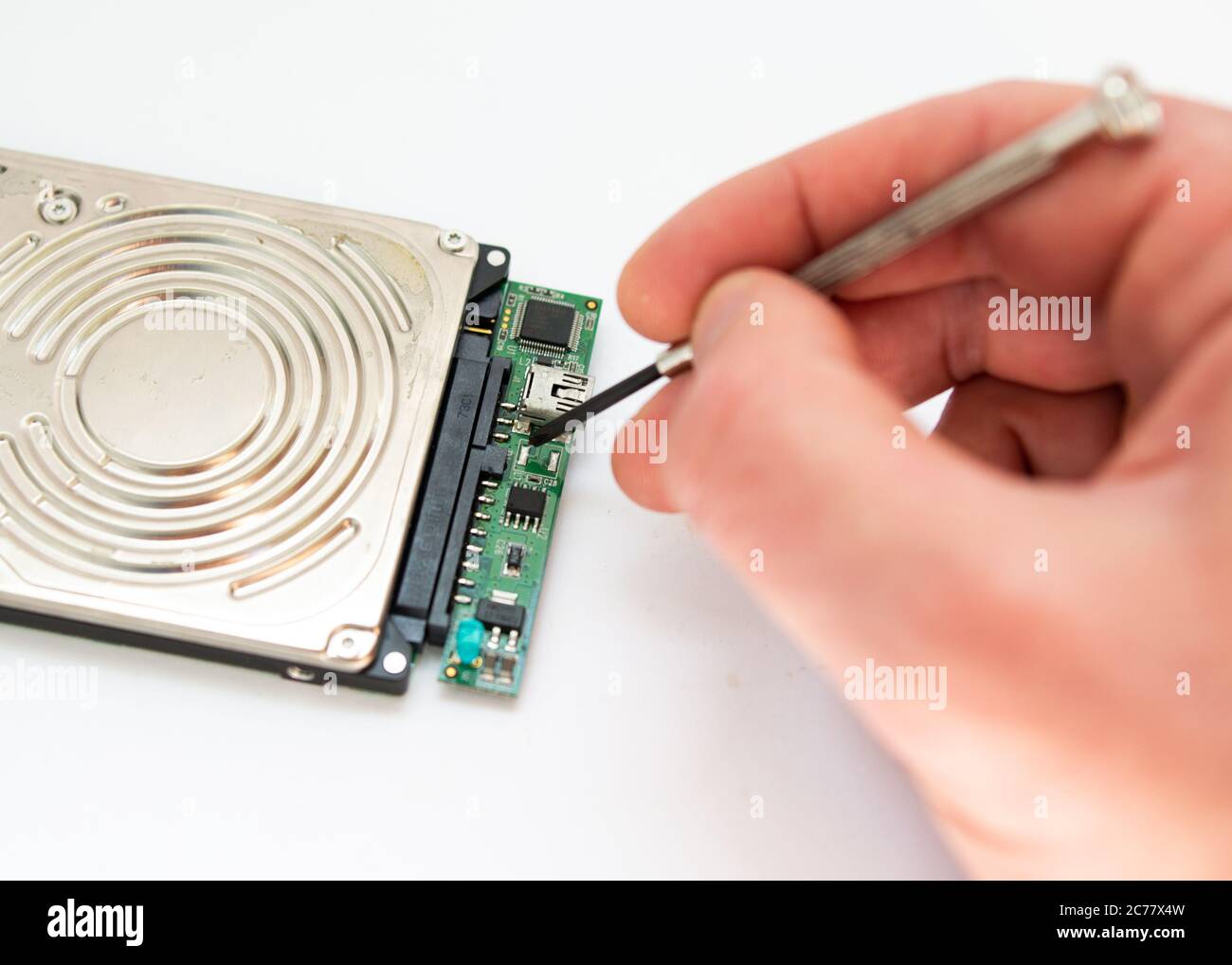 a man repairs hard drive Stock Photo