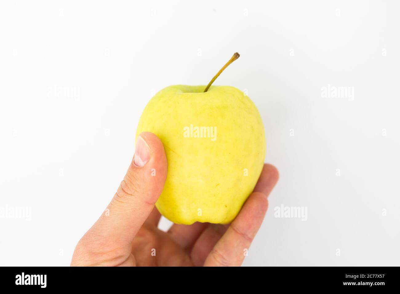 apple in hand on white background Stock Photo