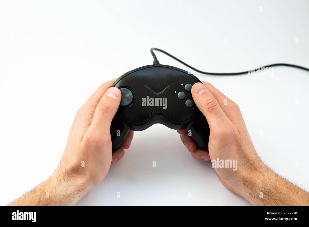 game joystick in hand on white background Stock Photo