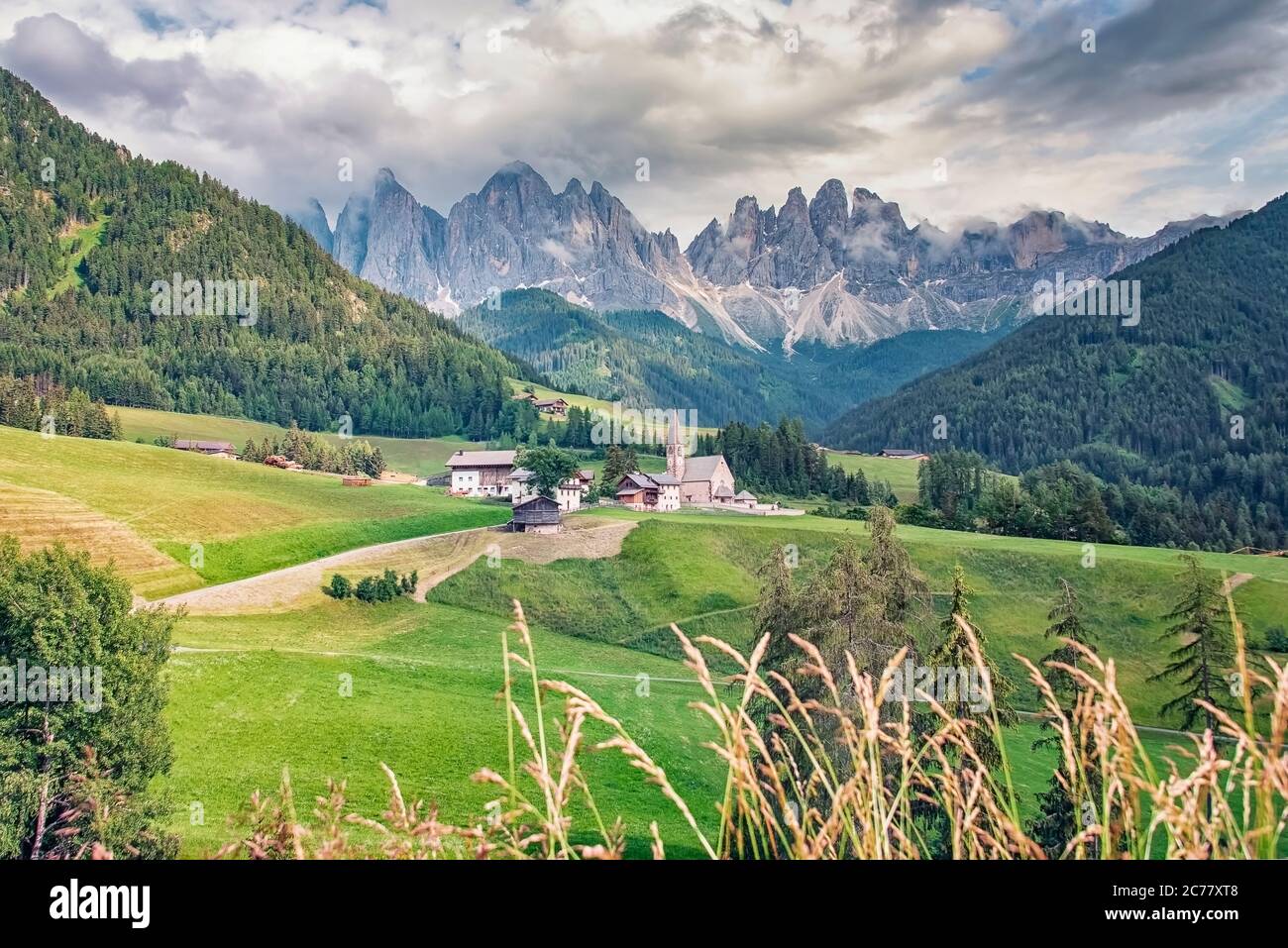 Santa Maddalena village with beautiful Dolomites mountains in the background, Val di Funes valley, Italy Stock Photo