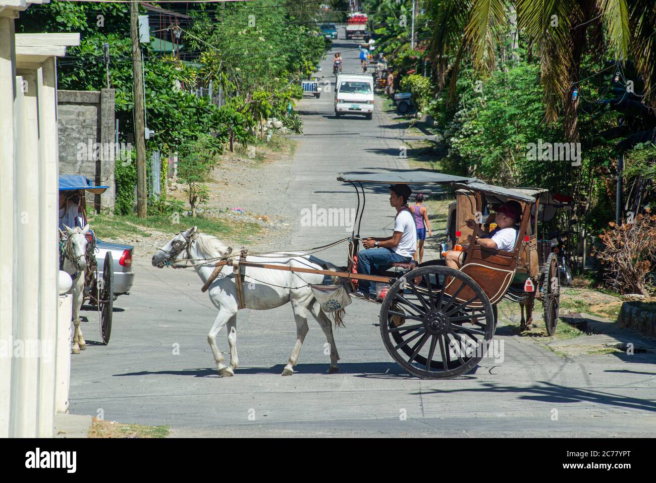 A horse and trap, known as a Kalesa, in use by tourists, Vigan, Philippines Stock Photo