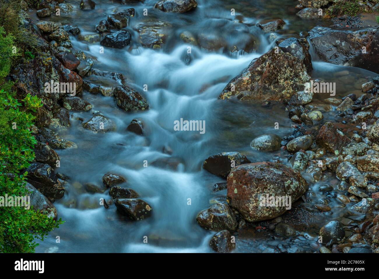 A slow exposure of an Alpine stream, from the slopes of Mt Ruapehu volcano in the North island of New Zealand. Stock Photo