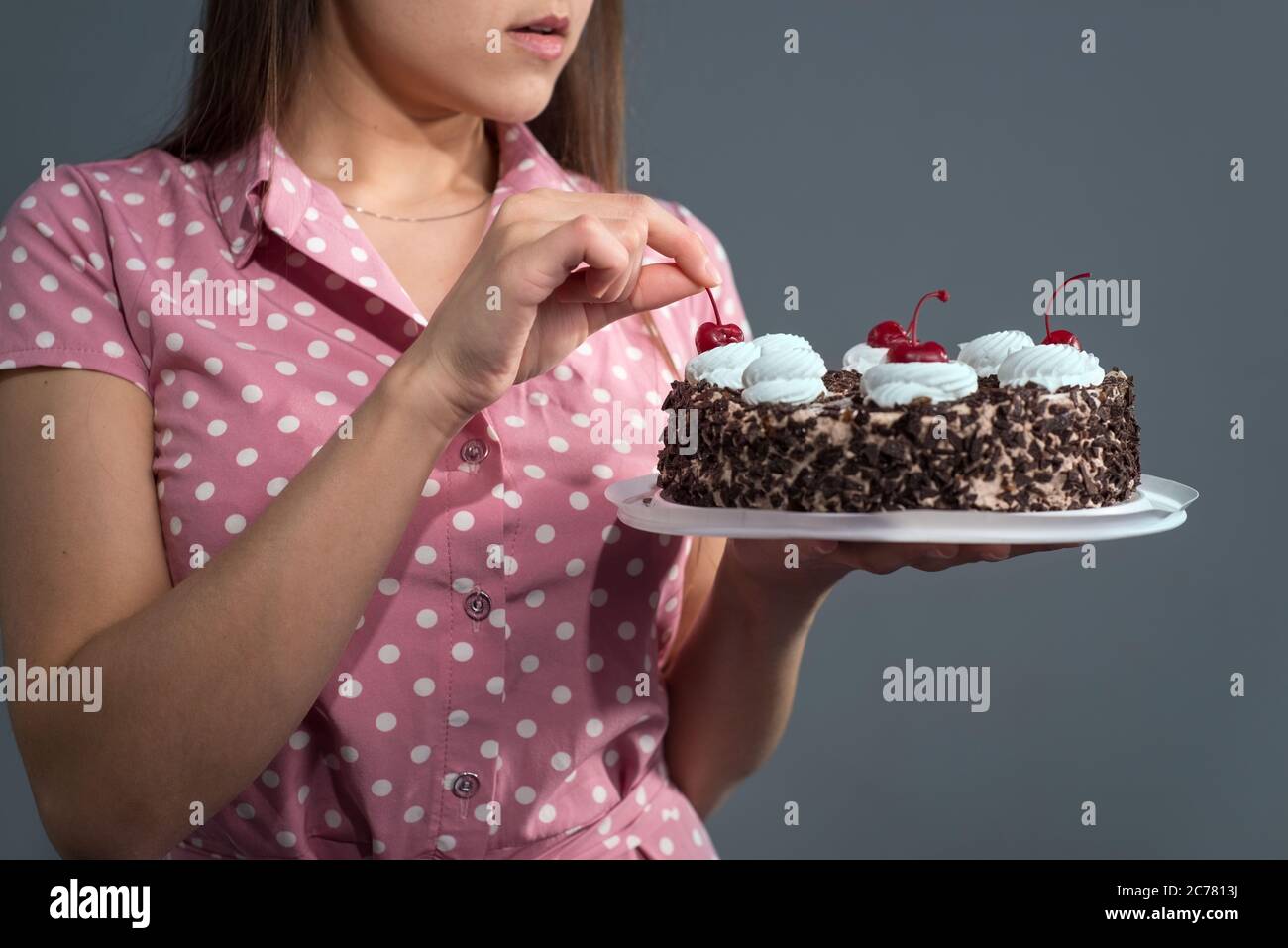 Close Up Of A Smiling Girl With A Dress With Polka Dots I See Birch From A Chocolate Cake Birthday Stock Photo Alamy