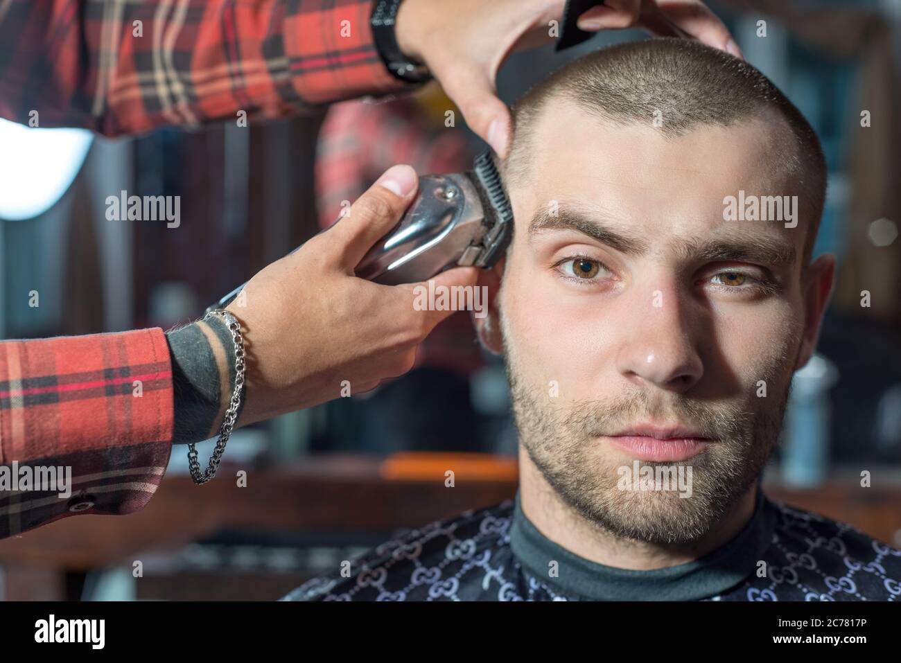 haircut of a young guy with a shield in a using a typewriter