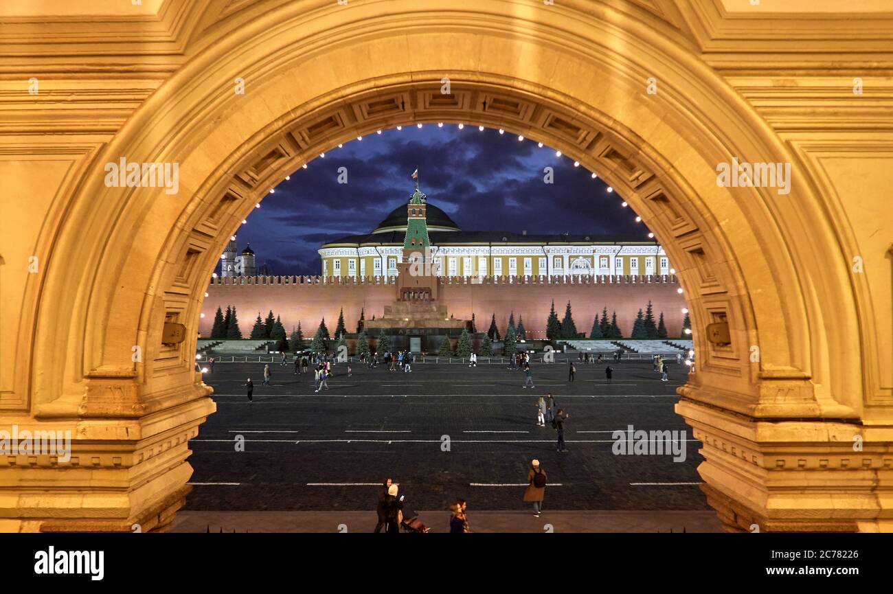 Moscow, Russia.   View of Lenin mausoleum and Kremlin through one of the arcades of the GUM shopping mall on Red Square, Landmark of Moscow. Stock Photo
