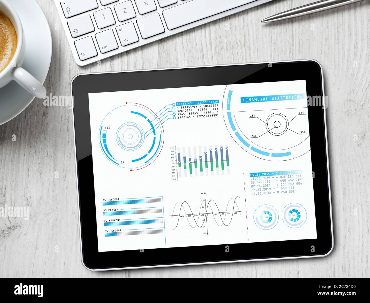 Graphs and charts on digital tablet Stock Photo