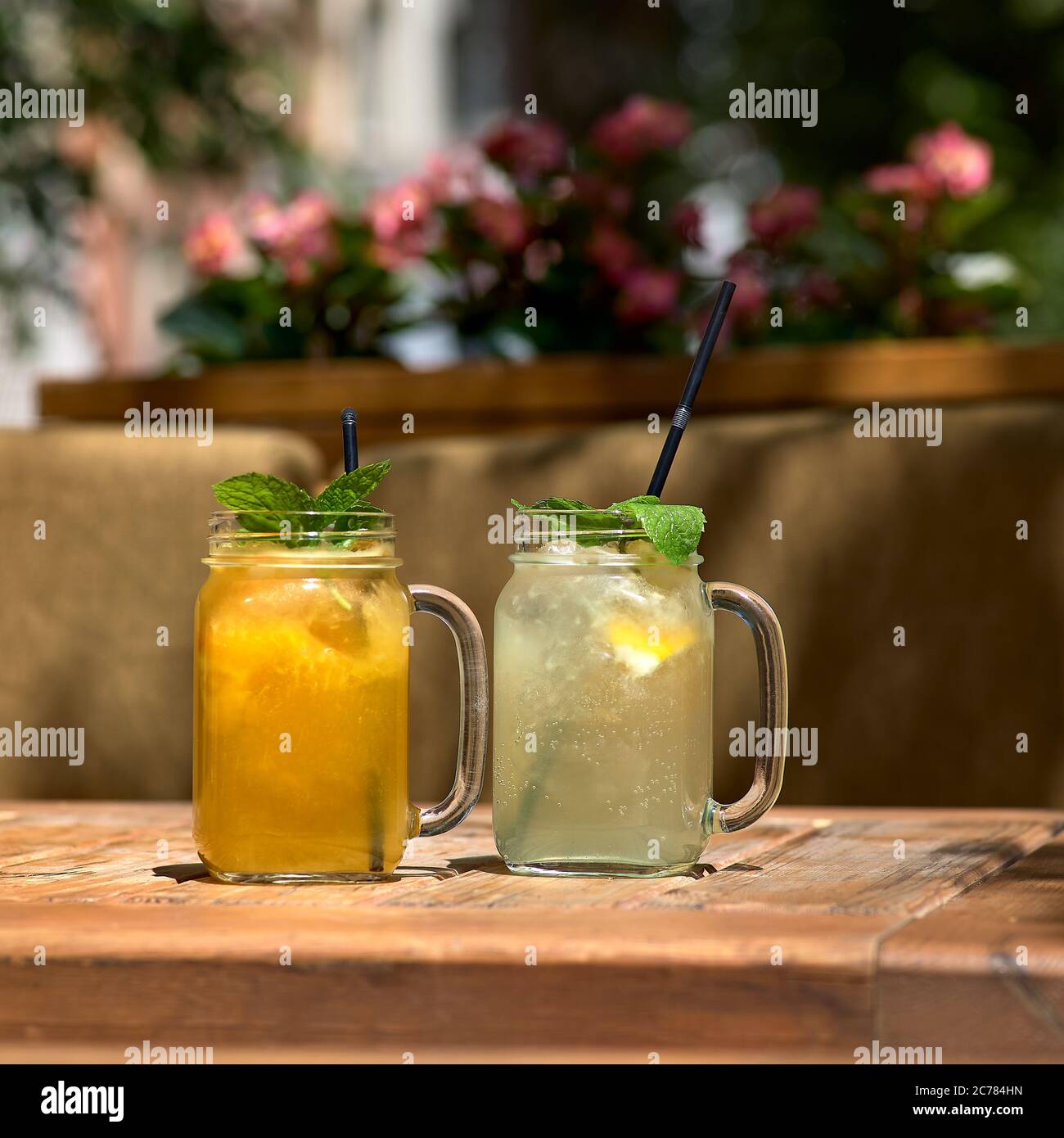 Cold and refreshing citrus fruit lemonade in mason jars with orange , lime and lemon. Stock Photo