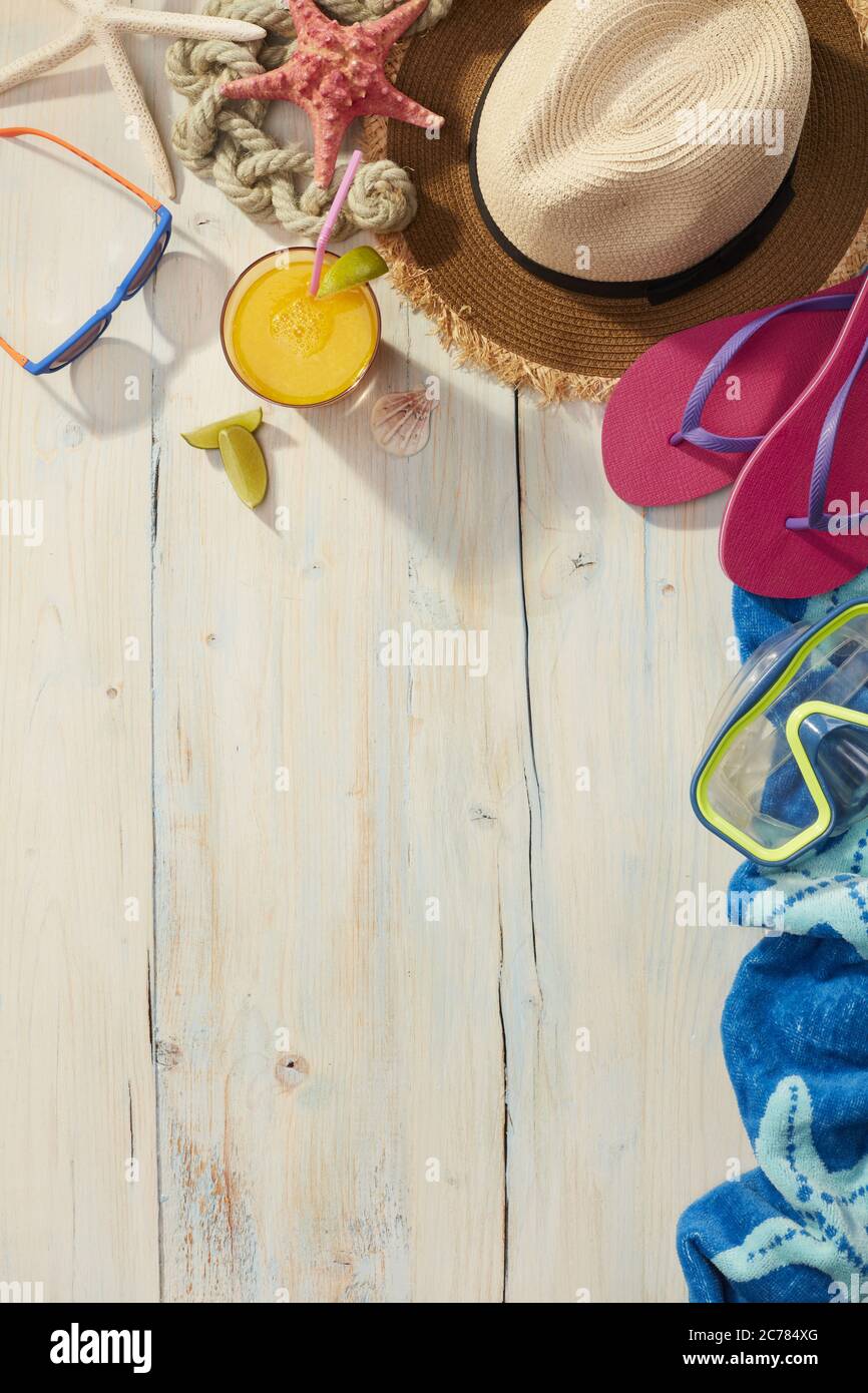Beach items on a wooden background Stock Photo