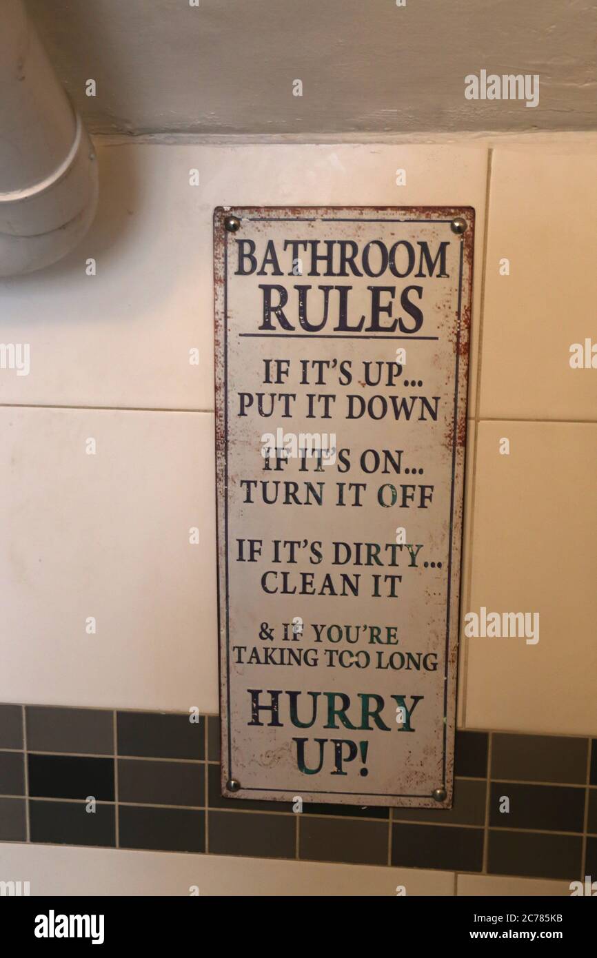 Bormla. (Citta Cospicua). Malta. A board in the restroom with information about funny 'Bathroom rules'. Stock Photo