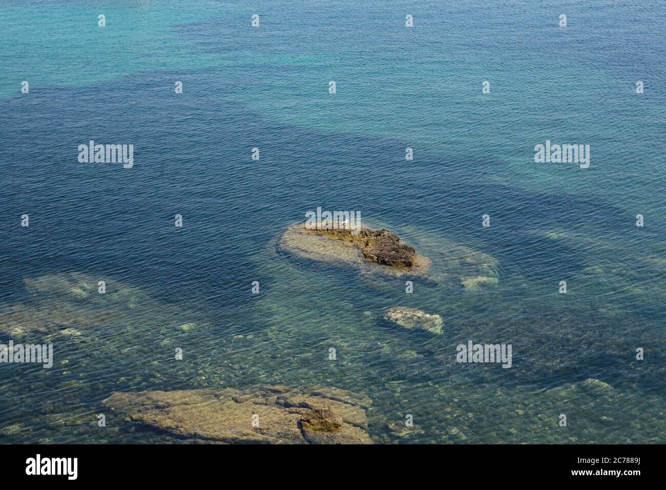 Open water and rocks Stock Photo - Alamy