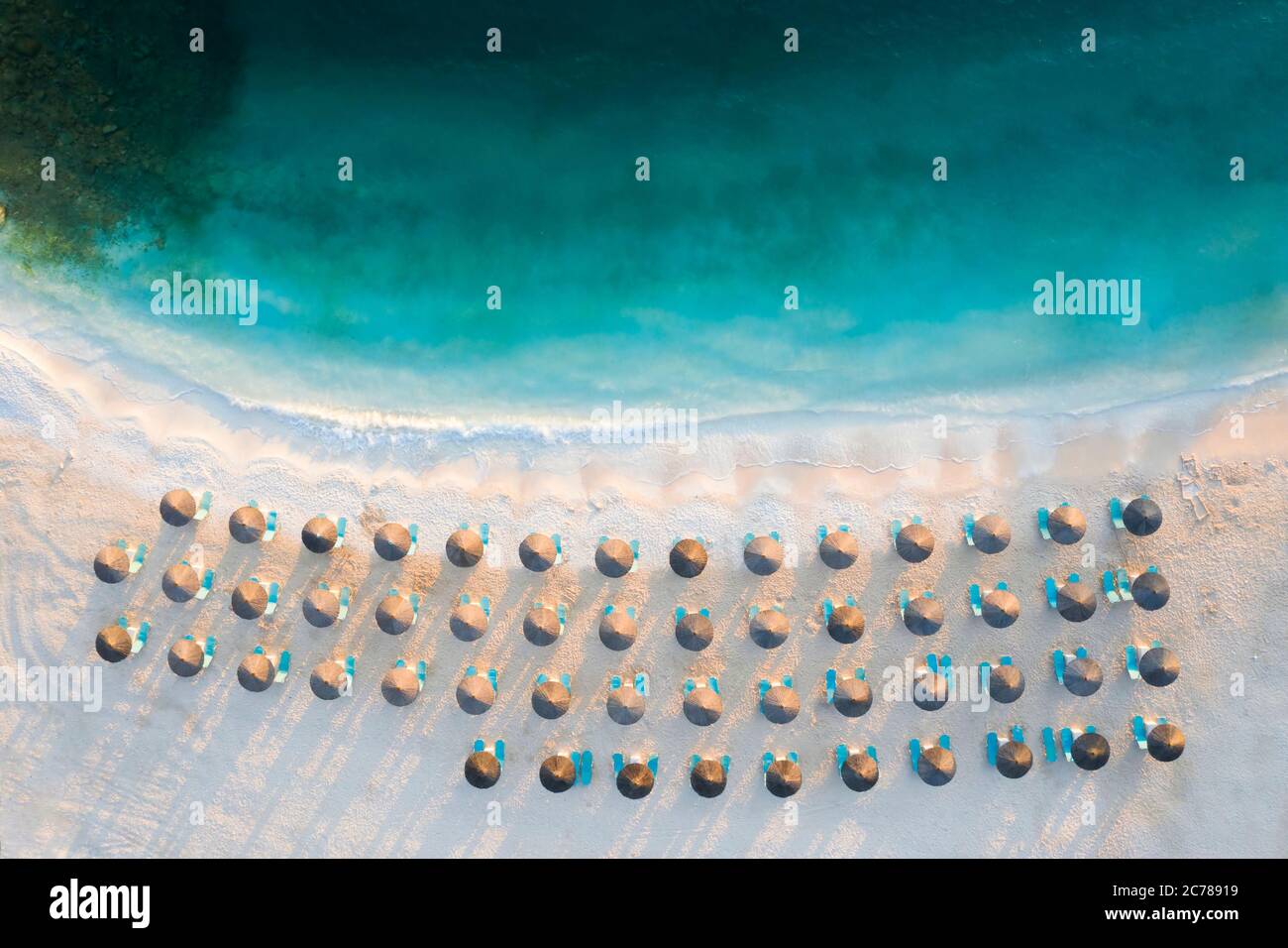 Aerial view of tropical sandy beach and blue ocean with crystal clear ...