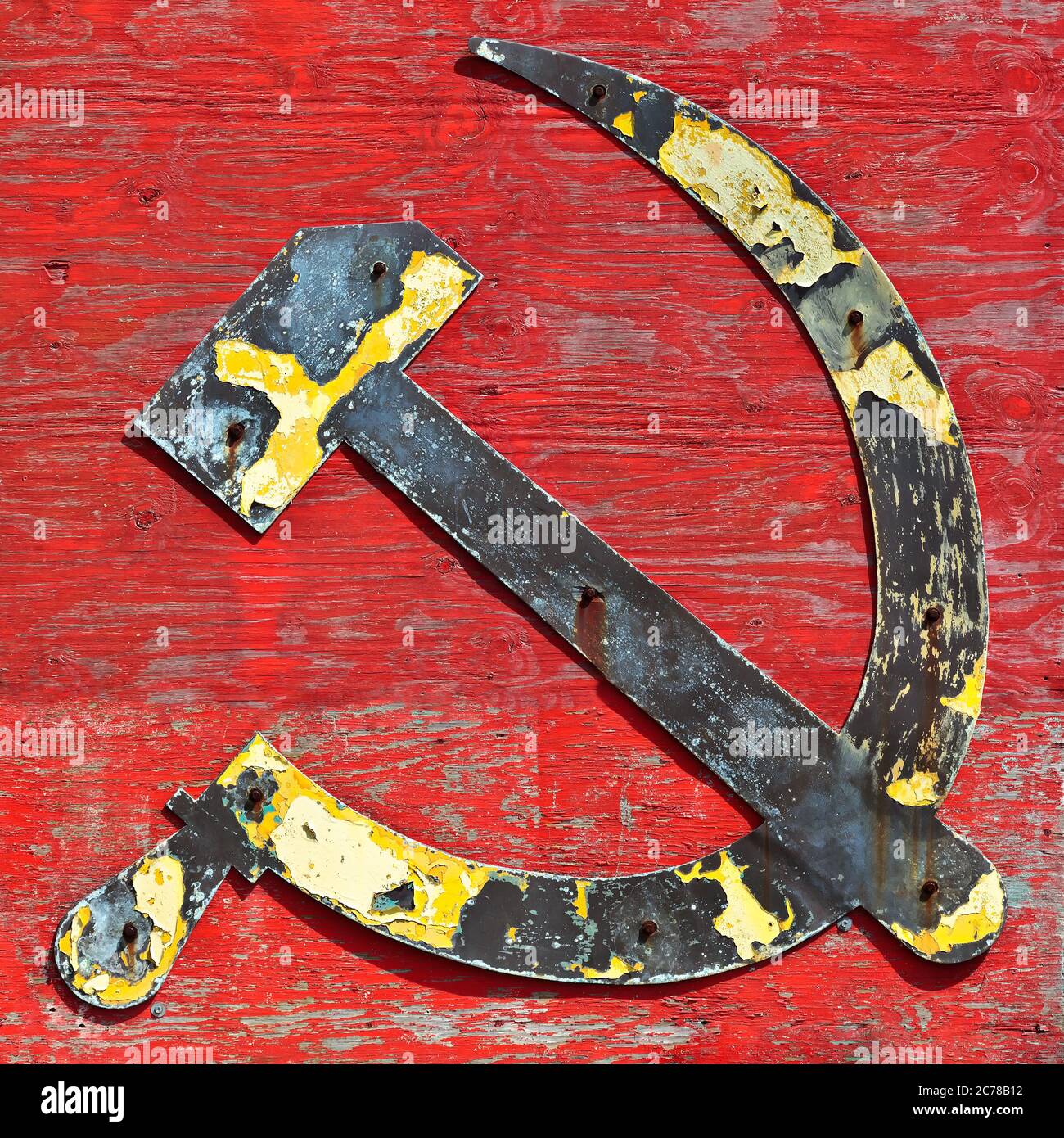 Part of an old wooden shipwreck with the cccp hammer and sickle in steel attached to it Stock Photo