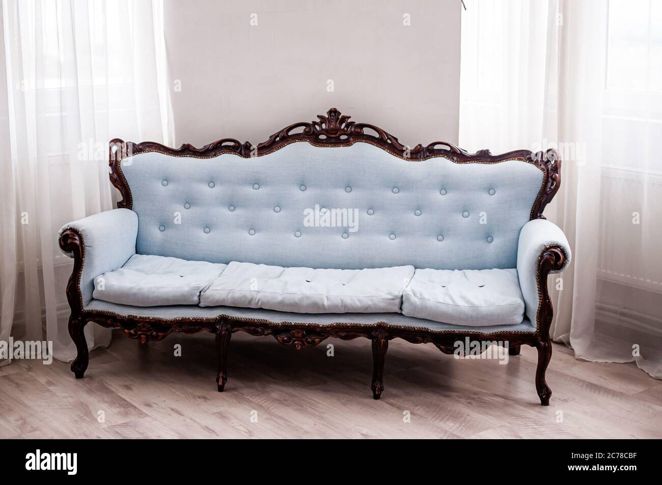 Antique gray baroque sofa in the room Stock Photo - Alamy