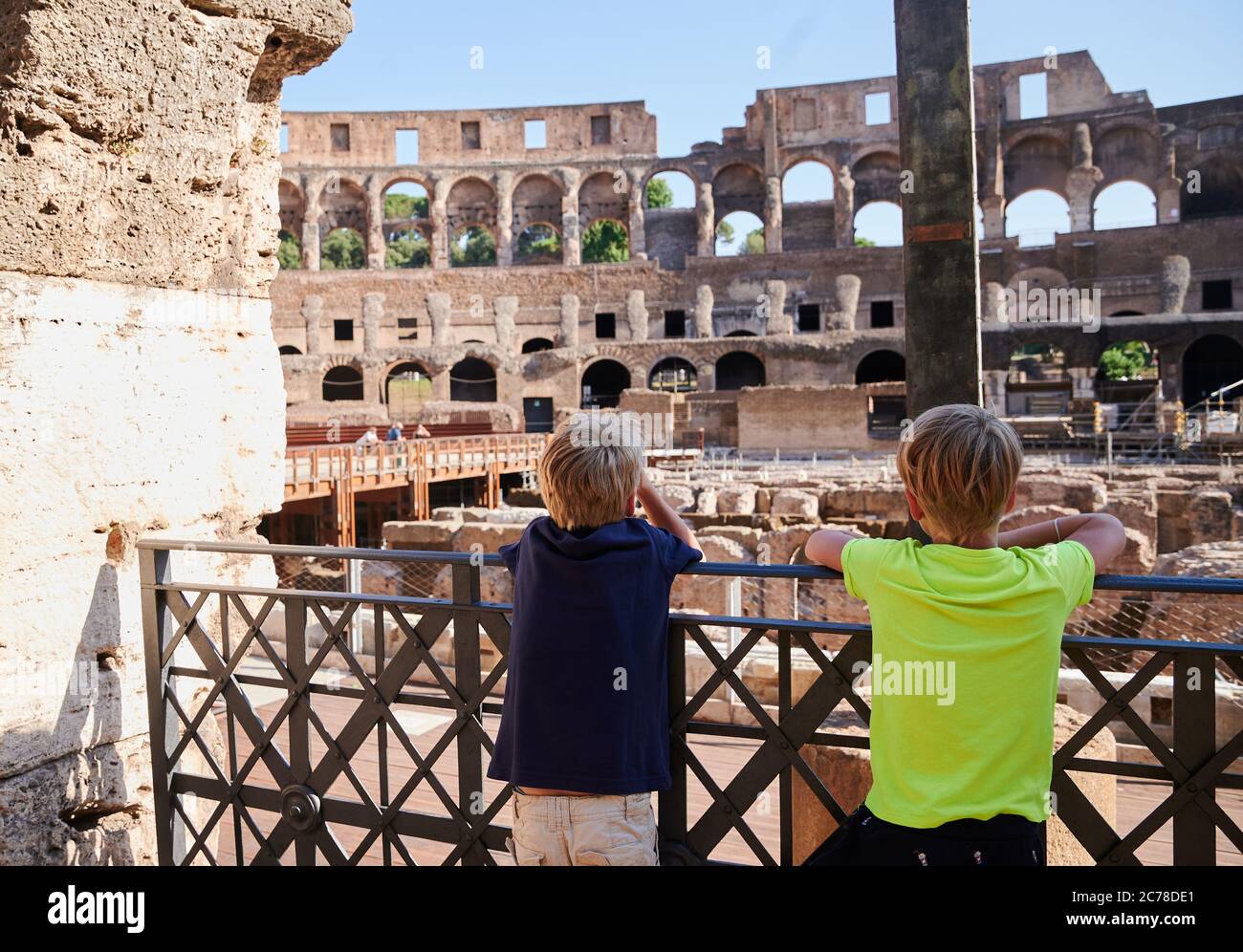Rom, Italy. 09th July, 2020. Two children are standing on the balustrade of  the Colosseum in Rome. Usually the visitors stand in several rows to visit  the popular amphitheatre. The travel restrictions