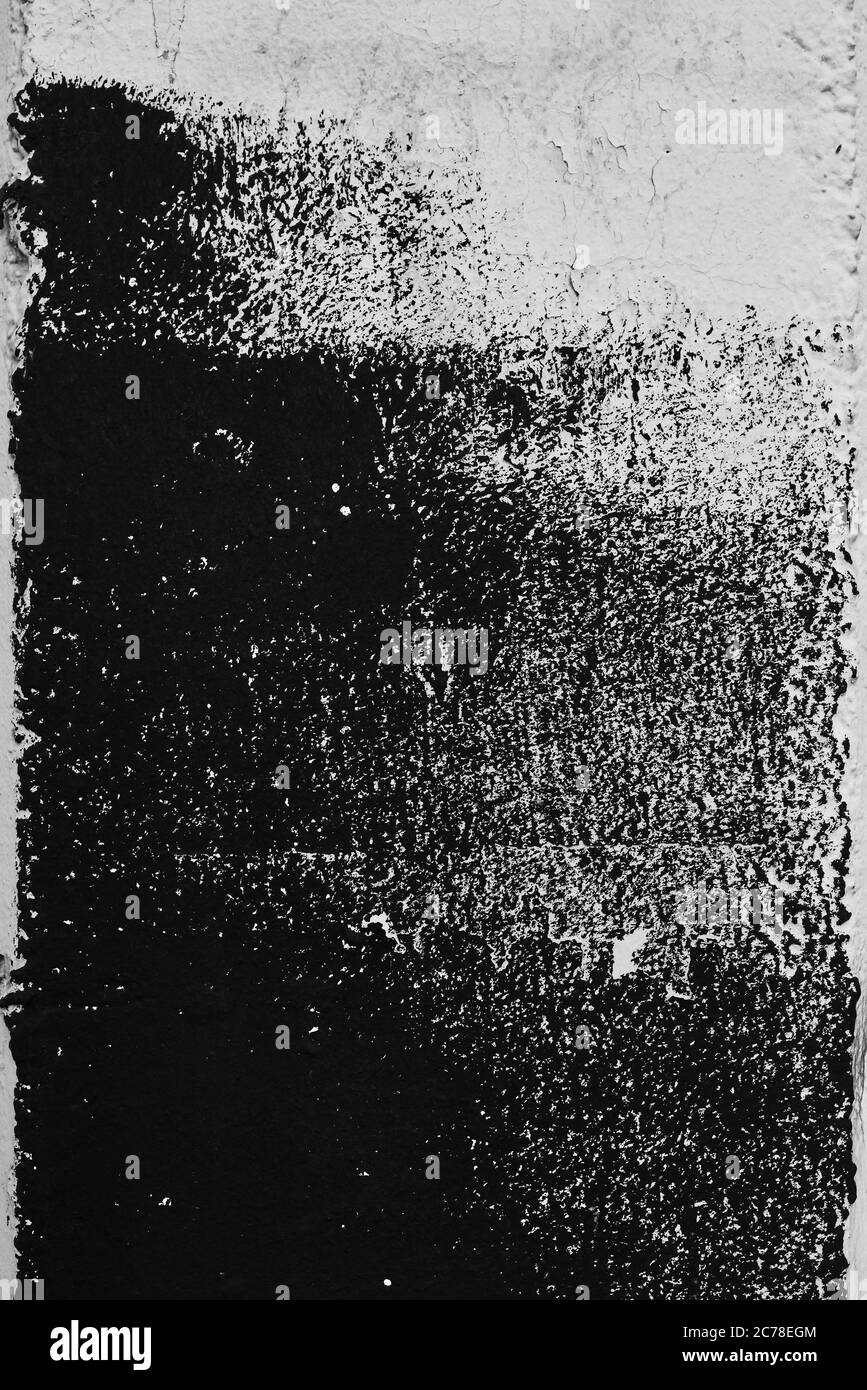 Abstract grunge texture pattern of black paint on white wall, dry brush technique Stock Photo