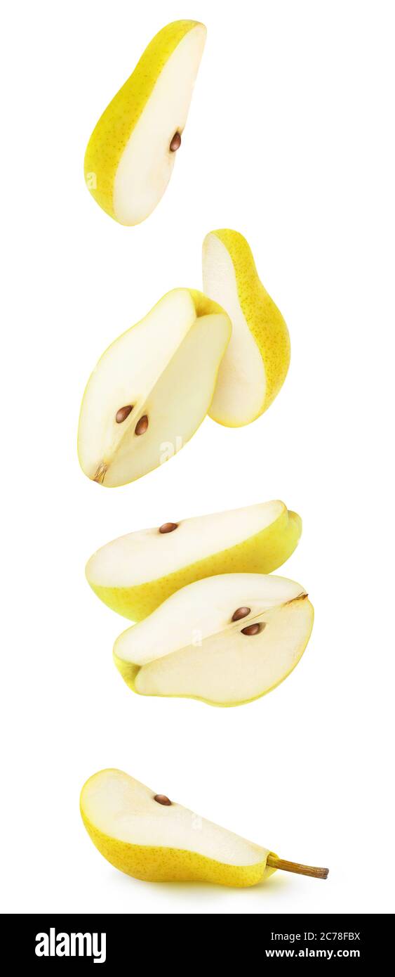 Isolated pear pieces in the air. Falling slices of yellow pears isolated on white background Stock Photo