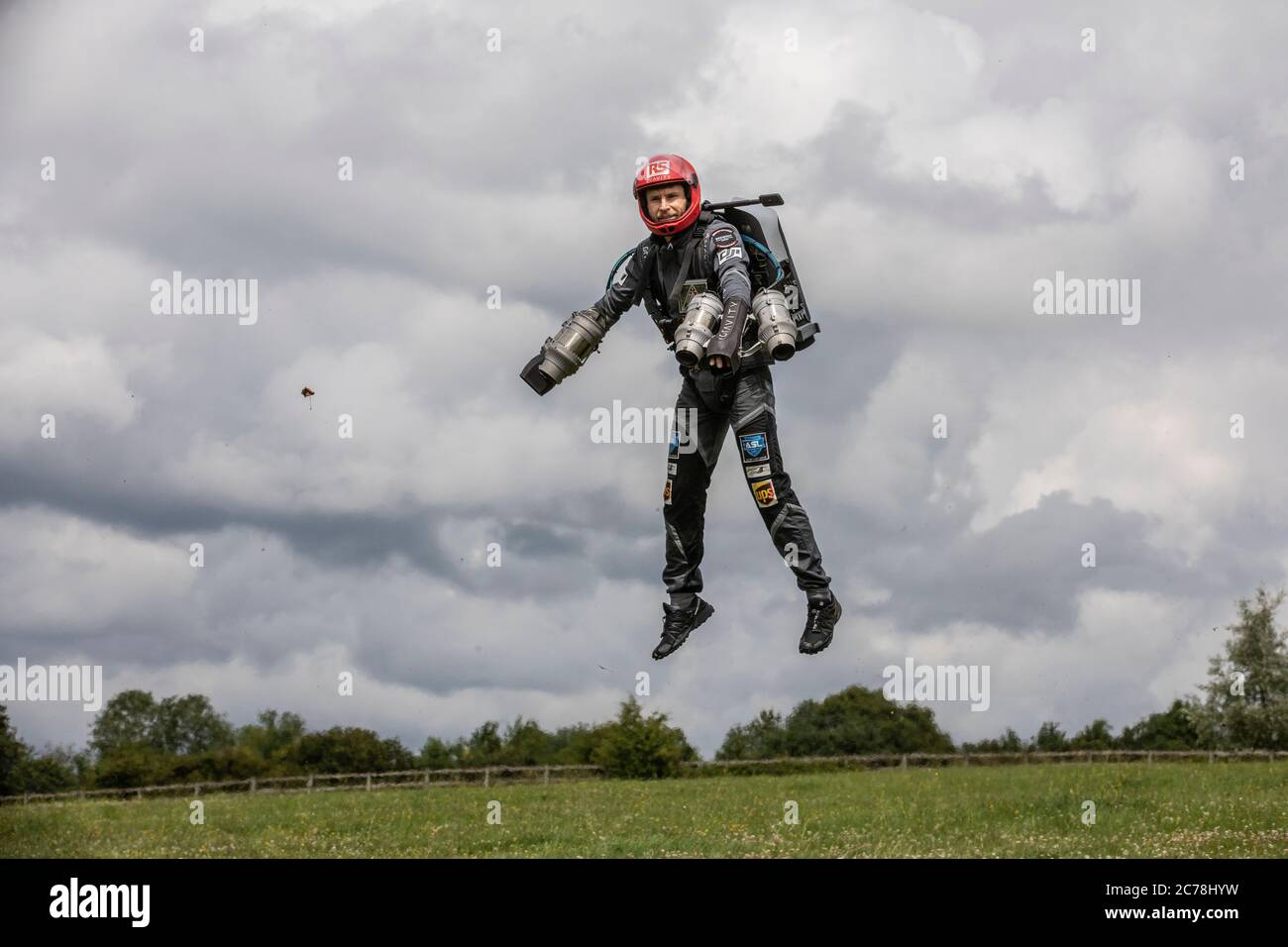 Richard Browning in his jetpack drops in the village of Binley in North Wessex Downs part of a display for Air Sports Group experience day, Andover UK Stock Photo