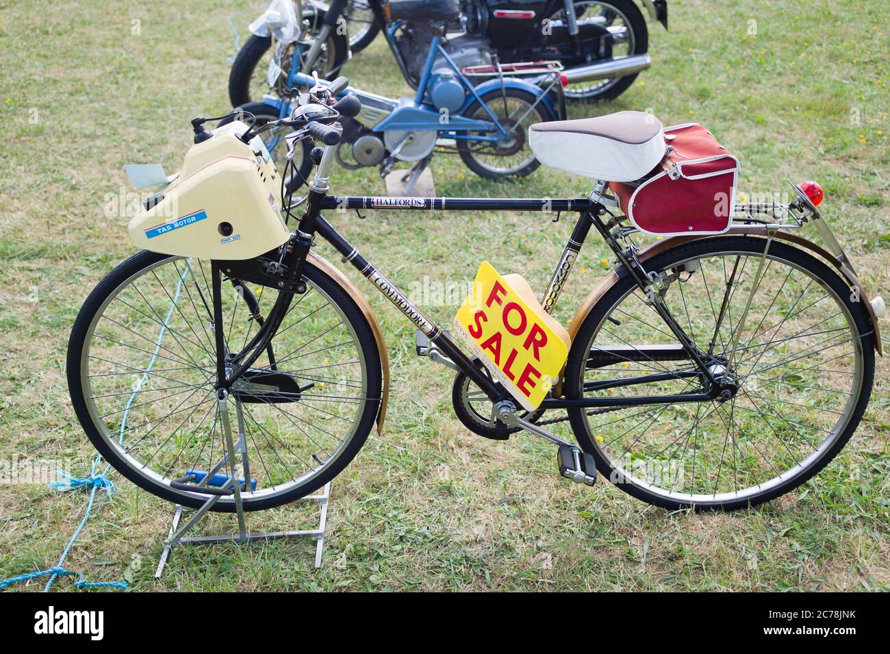 A 1970s pedal bicycle adapted to provide an external combusition engine for power-assistance on the road in UK Stock Photo