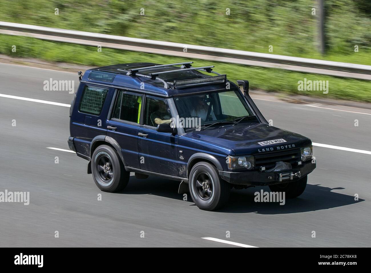 2003 Land Rover Discovery Td5 Gs Blue Car Hardtop Diesel driving on the M6 motorway near Preston in Lancashire, UK Stock Photo