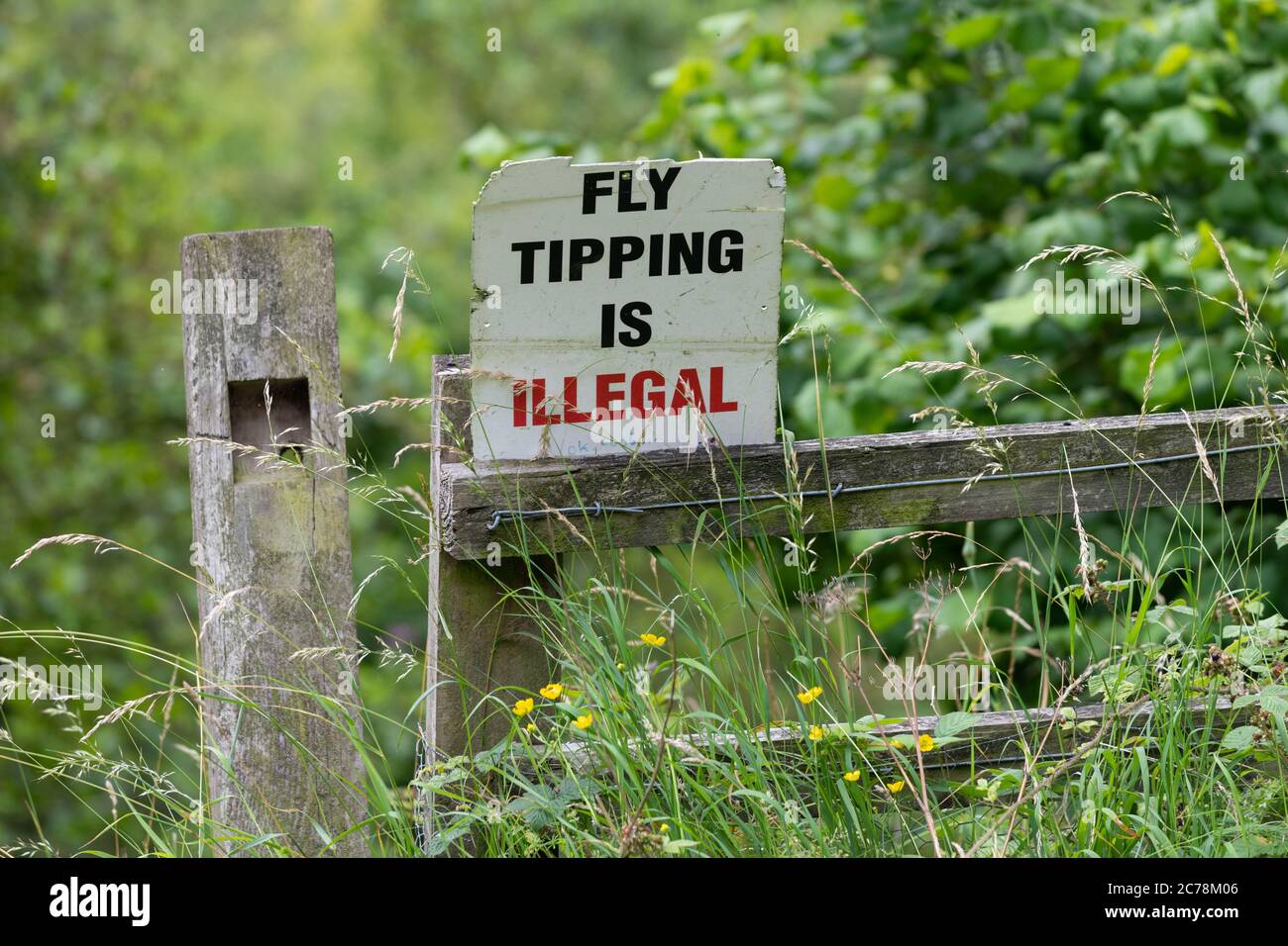 Fly tipping is illegal sign in rural spot - England, UK Stock Photo