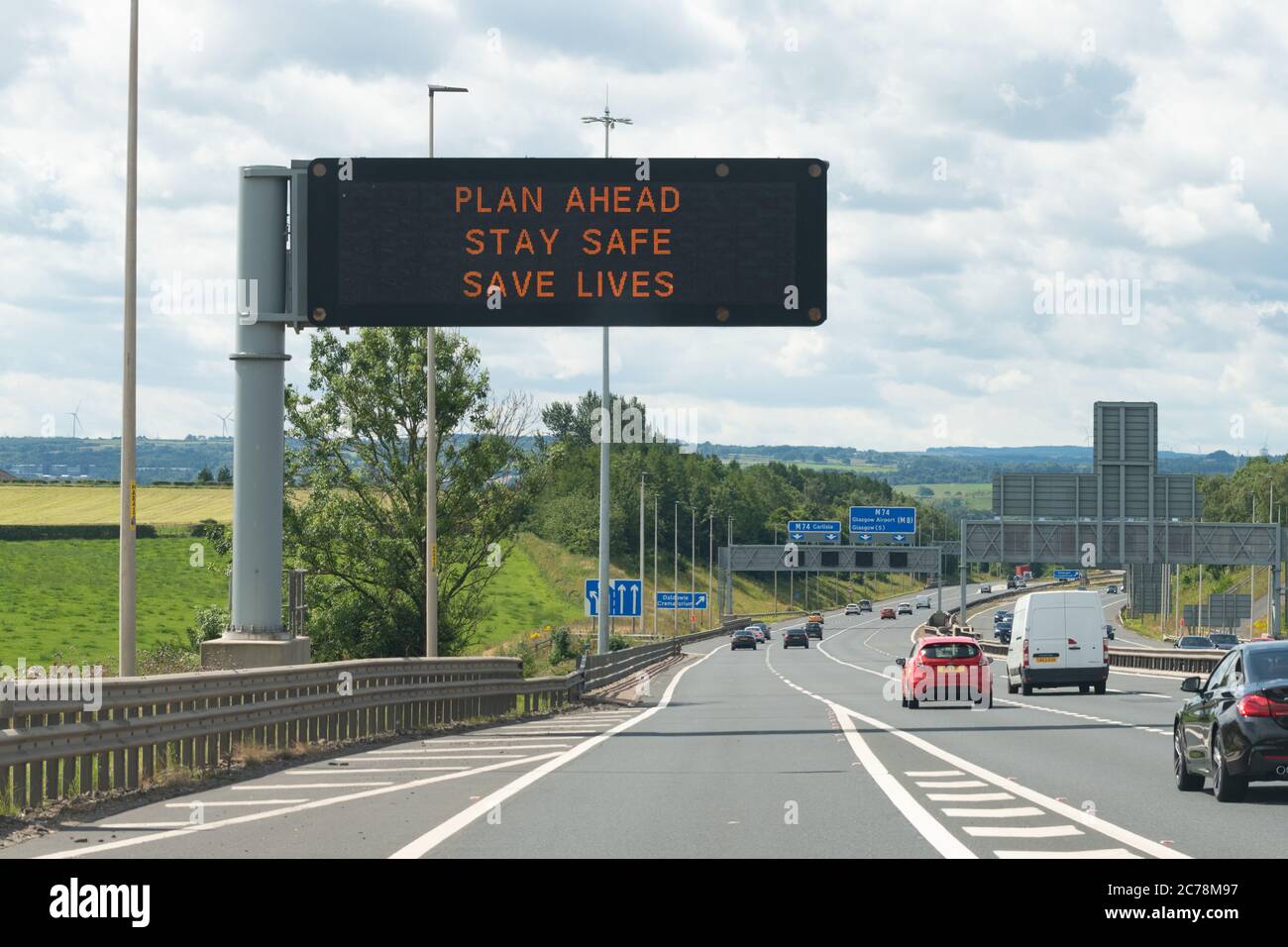 Coronavirus lockdown easing in Scotland variable message sign vms on M74 motorway 'Plan Ahead Stay Safe Save Lives' - Glasgow, Scotland, UK Stock Photo