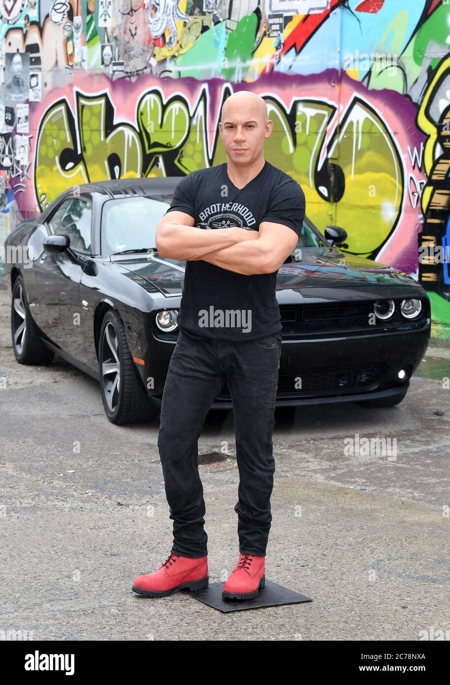 Berlin, Germany. 15th July, 2020. The wax figure of action star Vin Diesel  is standing in front of Club Cassiopeia on a Dodge Challenger, as driven in  the movies of "Fast and